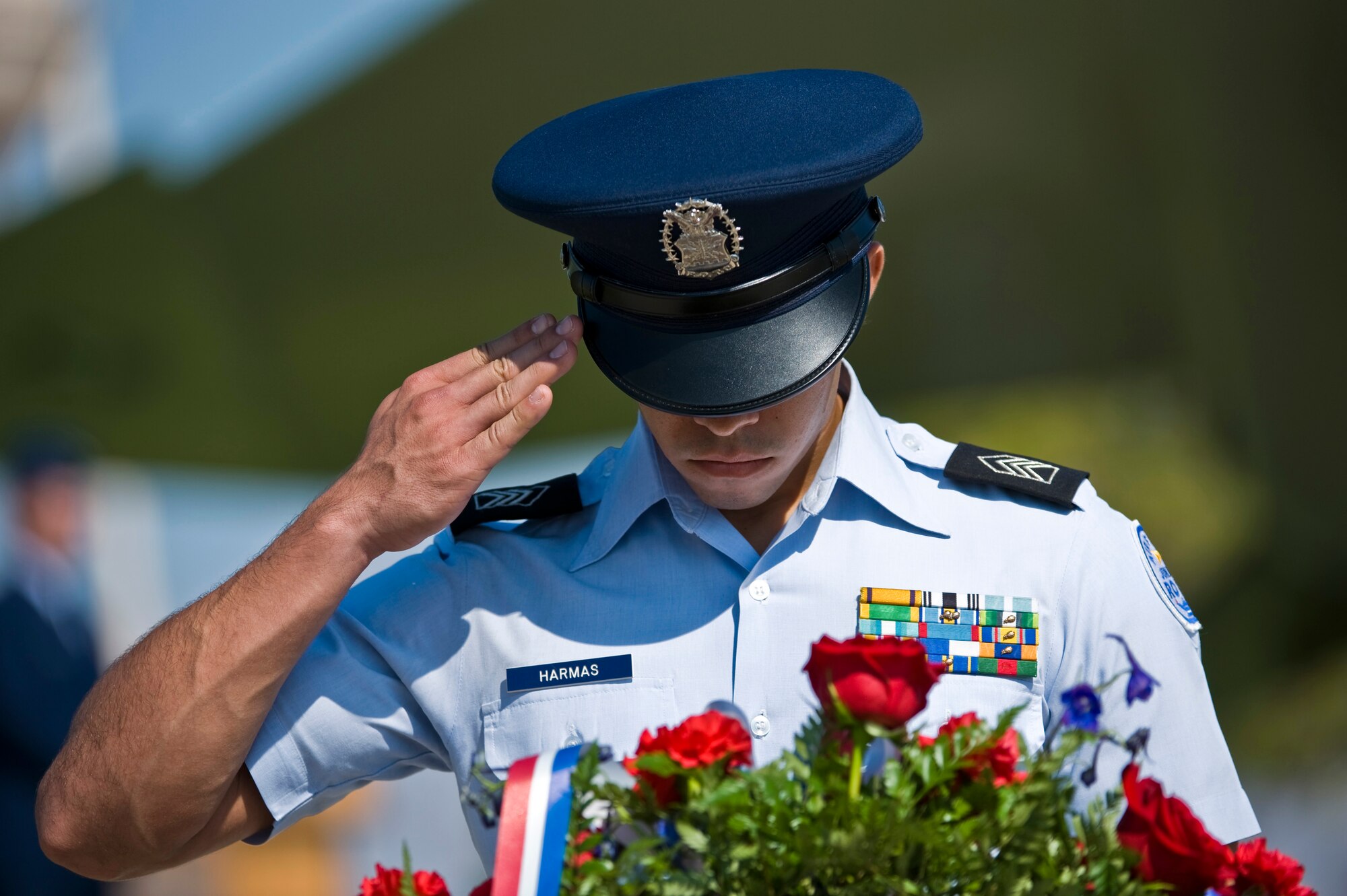 Cadet Capt. Adolfo Harmas, Rancho High School Air Force Junior Reserve Officer Training Corps cadet, renders a salute to the memorial wreath at the National Prisoner of War/Missing in Action Recognition Day ceremony Sept. 16, 2011, at Freedom Park on Nellis Air Force Base, Nev. The ceremony included the dedication of a POW/MIA ceremonial wreath, the reciting of names of Nevadans who are war prisoners and those who are still missing, a 21-gun salute by a rifle firing party and an F-16 Fighting Falcon flyover. (U.S. Air Force photo by Senior Airman Brett Clashman/Released)
