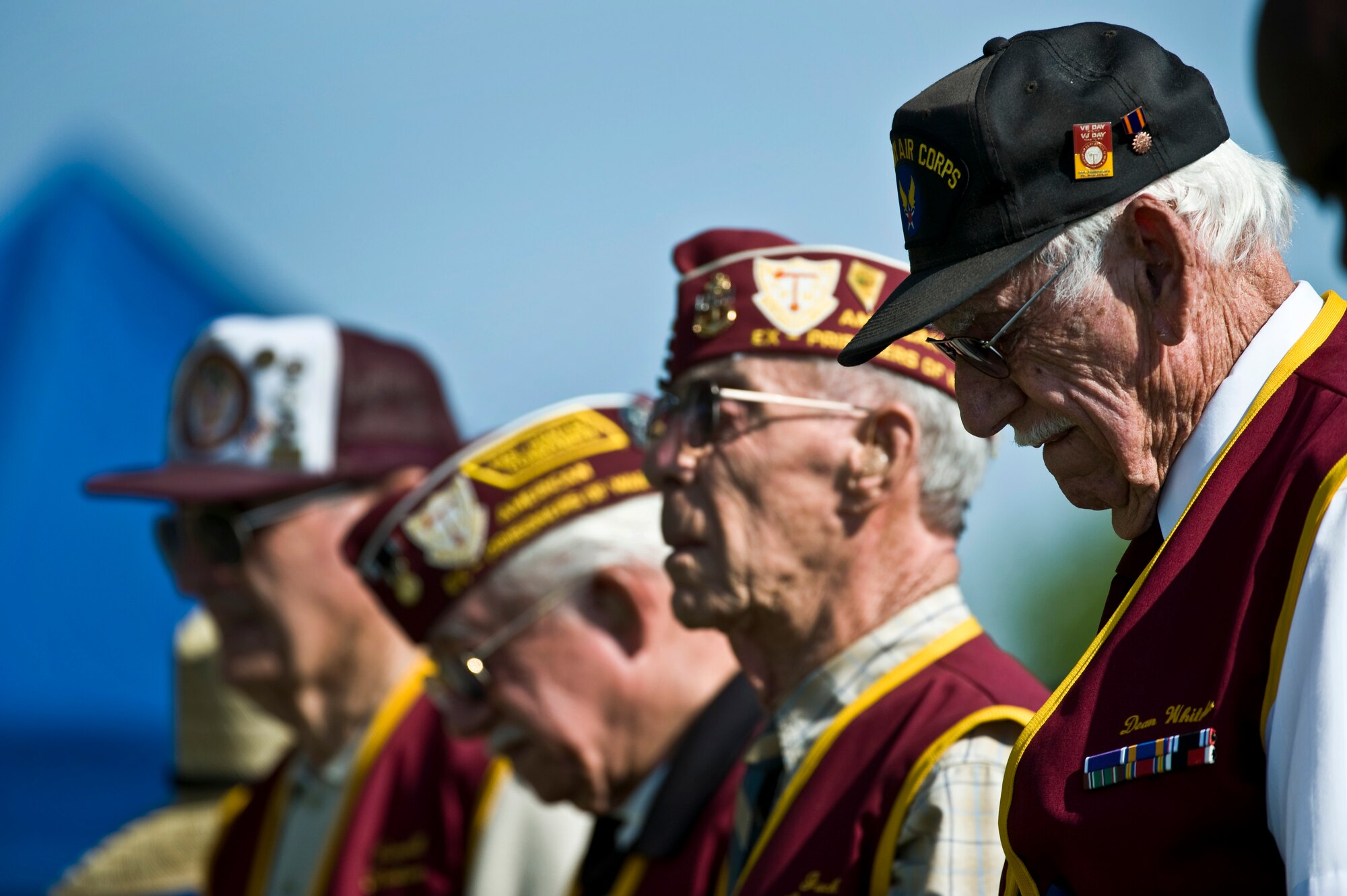 Dean Whitaker, 7-11 Chapter of American Ex-Prisoners of War commander, and members of the 7-11 Chapter bow their heads in prayer at the National Prisoner of War/Missing in Action Recognition Day ceremony Sept. 16, 2011, at Freedom Park on Nellis Air Force Base, Nev. The ceremony included the dedication of a POW/MIA ceremonial wreath, the reciting of names of Nevadans who are war prisoners and those who are still missing, a 21-gun salute by a rifle firing party and an F-16 Fighting Falcon flyover. (U.S. Air Force photo by Senior Airman Brett Clashman/Released)
