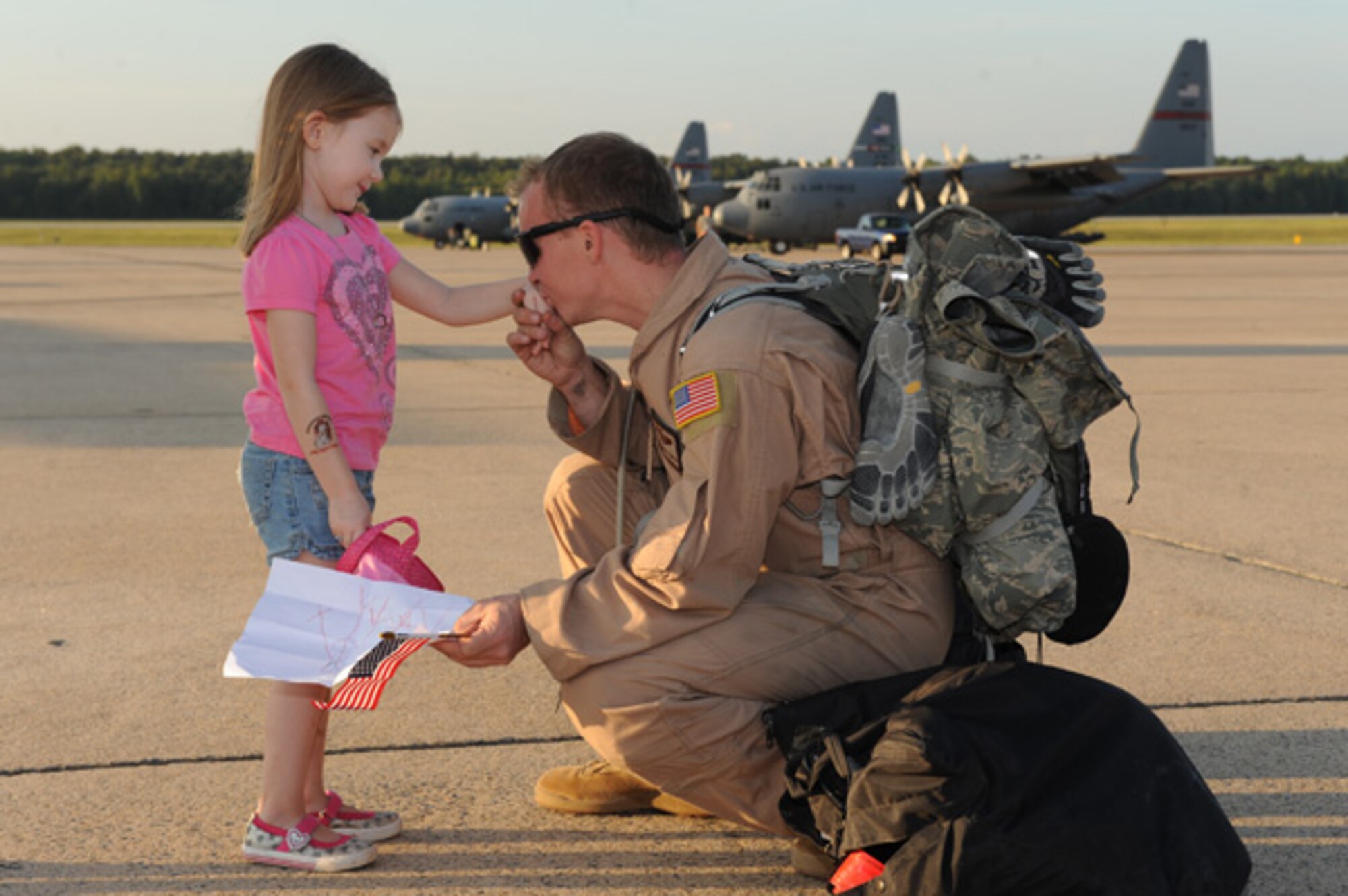 Jorja Thornton, 4, welcomes home her dad, Tech. Sgt. Lynzy Thornton, a 41st
Airlift Squadron loadmaster, on the Little Rock Air Force Base's, Ark.,
flight line Sept. 20, 2011. Thornton, and other Airmen from the 41st were
deployed to Kandahar, Afghanistan, supporting airlift operations in
Southwest Asia. (U.S. Air Force photo by Tech. Sgt. Chad Chisholm)
