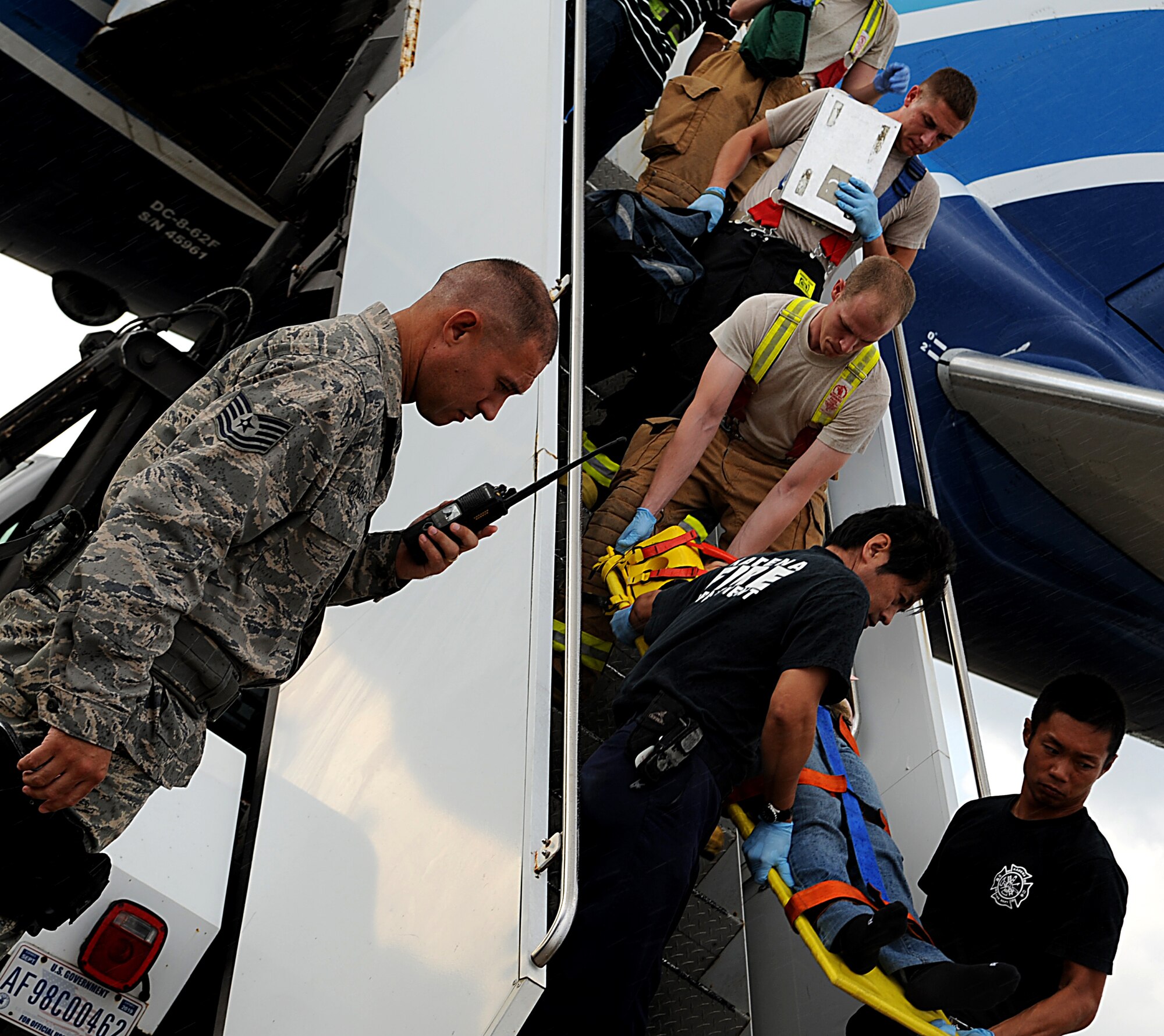 Tech. Sgt. Daniel Gonzalez, 18th Security Forces Squadron member, provides security for a passenger aircraft that landed due to an in-flight emergency Sept. 10 on Kadena Air Base, Japan. Gonzalez was recently named to the 2011 edition of “Portraits in Courage” for his actions while deployed to Afghanistan. (U.S. Air Force photo/Staff Sgt. Christopher Hummel)