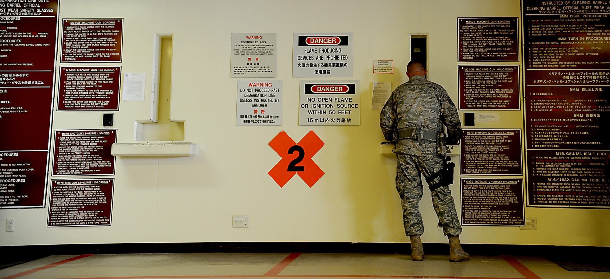 Tech. Sgt. Daniel Gonzalez, 18th Security Forces Squadron member, prepares to “arm-up” as he awaits his side-arm before being posted to patrol Sept. 10 on Kadena Air Base, Japan. Gonzalez was recently named to the 2011 edition of “Portraits in Courage” for his actions while deployed to Afghanistan. (U.S. Air Force photo/Staff Sgt. Christopher Hummel)