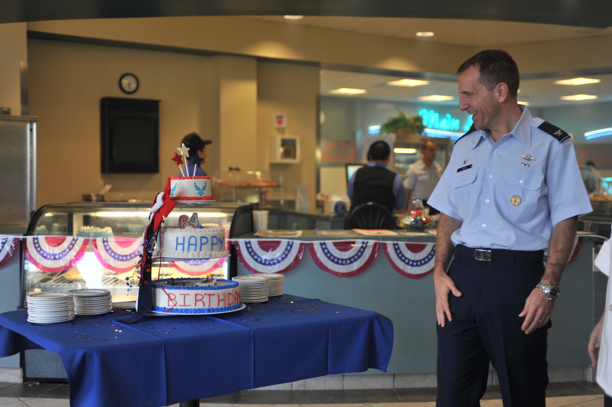 Col. James Slife, commander of the 1st Special Operations Wing, admires a cake celebrating the Air Force’s 64th birthday at the Riptide Dining Facility at Hurlburt Field, Fla., Sept. 19, 2011. Traditionally the base honors the Air Force’s birthday with a ceremonial cutting of a cake performed by the most senior and the junior ranking Airmen in attendance. (U.S. Air Force Photo/Airman 1st Class Hayden K. Hyatt/ Released) 
