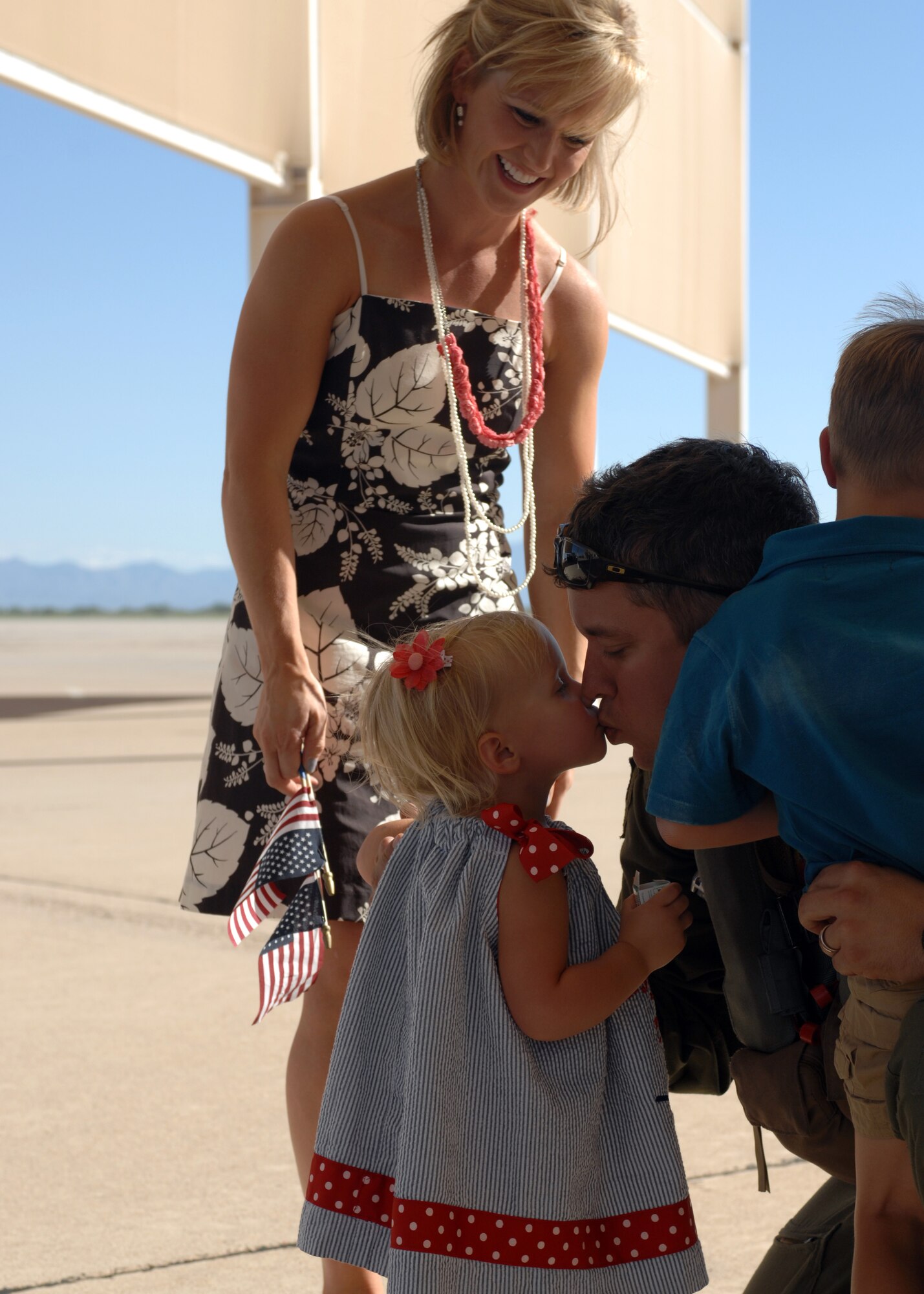 DAVIS-MONTHAN AIR FORCE BASE, Ariz. – Capt. William Yoakley, 354th Fighter Squadron A-10 pilot, greets his family as he returns here from a deployment Sept. 19. Captain Yoakley just was on a six-month deployment at Osan Air Base, Republic of Korea. (U.S. Air Force photo/Airman 1st Class Timothy D. Moore)