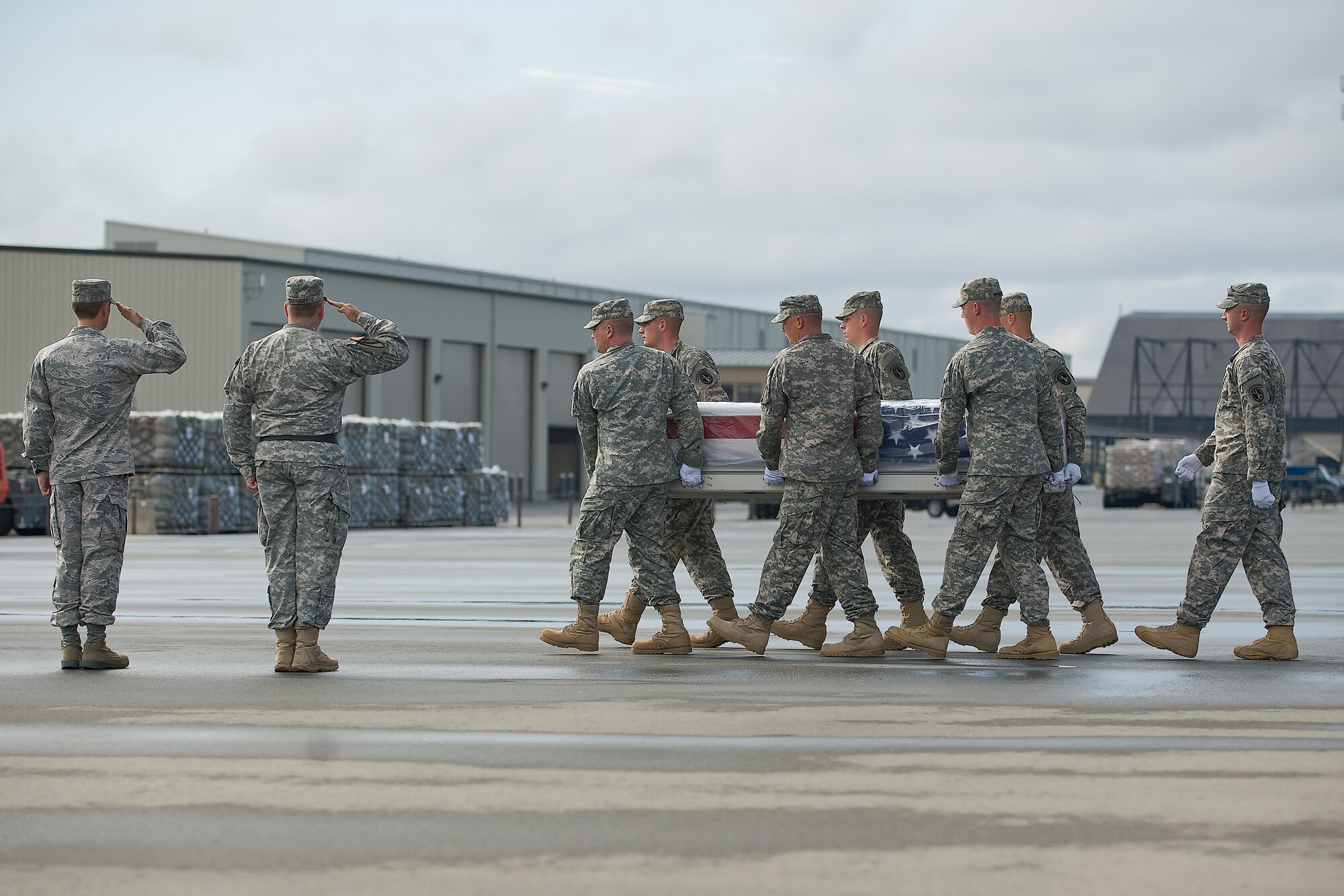 A U.S. Army carry team transfers the remains of Army Sgt. Esteven Altamirano, of Edcouch, Texas, at Dover Air Force Base, Del., Sept. 20, 2011. Altamirano was assigned to Company D, 1st Battlation, 5th Calvary, 2 BCT, Fort Hood, Texas.(U.S. Air Force photo/Steve Kotecki)