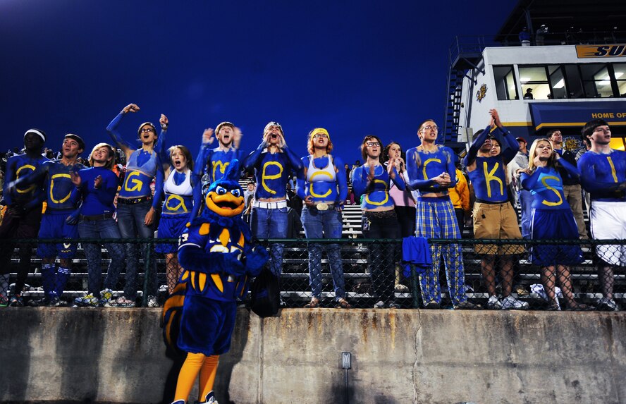 Sumter High School teens and their mascot, Gamecock, cheer on their team during the Sumter versus North Augusta High School game at Sumter High School Football Stadium, S.C., Sept. 16, 2011. Sumter High School held a Military appreciation night where Shaw Air Force Base Honor Guard posted the 'Colors' and Mr. John Kennedy, 20th Force Support Squadron school liaison officer sang the National Anthem. (U.S. Air Force photo by Airman 1st Class Tabatha Duarte/Released)