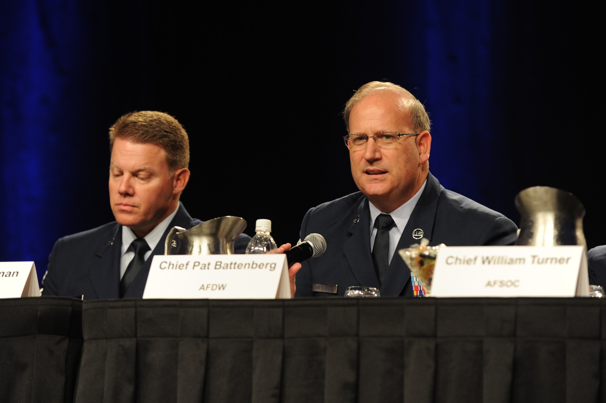 Chief Master Sgt. Eric R. Jaren, the command chief of Air Force Material Command, shares a question from the attendees as moderator of the Command Chief Master Sergeant Forum during the Air Force Association's 2011 Air & Space Conference & Technology Exposition in National Harbor, Md. The forum included (from left to right) Chief Master Sgt. Chris Muncy, the Air National Guard command chief, Chief Master Sgt. Todd Salzman, the Air Force Academy command chief, Chief Master Sgt. Pat Battenberg, the Air Force District of Washington command chief, Chief Master Sgt. William Turner, command chief for Air Force Special Operations Command and Chief Master Sgt. James Cody, command chief for Air Education and Training Command. (U.S. Air Force photo by Airman 1st Class Melissa Goslin)