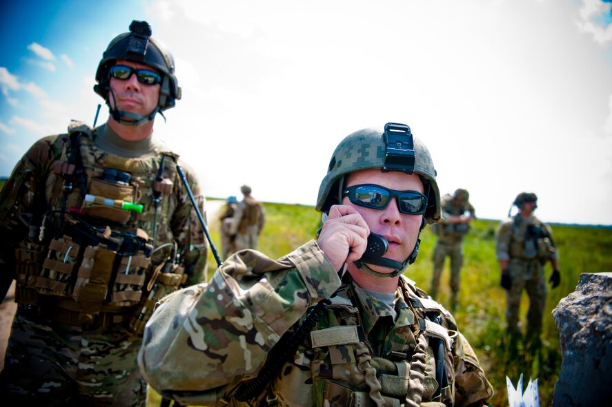 U.S. Air Force Senior Airman James Ingram, 11th Air Support Operations Squadron joint terminal attack controller out of Fort Hood, Texas, communicates with a pilot during exercise Atlantic Strike 11-02 at Avon Park Air Force Range, Fla., Sept. 13, 2011. The exercise allowed Ingram to perform upgrade training tasks and provided a realistic training environment to conduct close air support duties. It was his first time participating in the exercise. (U.S. Air Force photo by Staff Sgt. Jamal D. Sutter/Released)