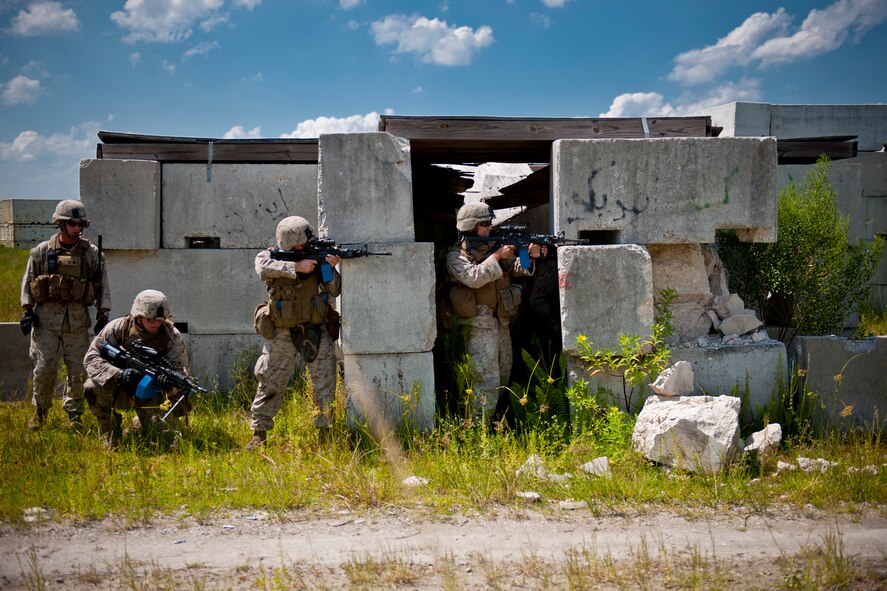 U.S. Marine Corps members of the 2nd Tank Battalion out of Marine Corps Base Camp Lejeune, N.C., engage enemies during exercise Atlantic Strike 11-02 at Avon Park Air Force Range, Fla., Sept. 13, 2011. Supplementing U.S. Air Force joint terminal attack controllers, the battalion provided a realistic ground force for JTACs to conduct close are support for. (U.S. Air Force photo by Staff Sgt. Jamal D. Sutter/Released) 
