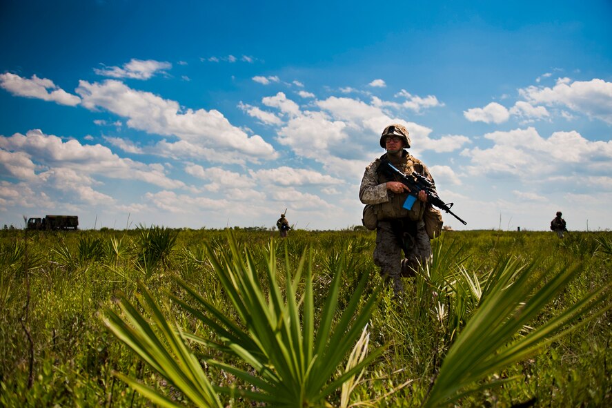 U.S. Marine Corps Pfc. Aaron Bowen, 2nd Tank Battalion antitank missileman, assesses the area during exercise Atlantic Strike 11-02 at Avon Park Air Force Range, Fla., Sept. 13, 2011. Bowen and his team organized a tactical formation after being attacked during a simulated training mission. Their job was to eliminate the opposing forces while providing support to U.S. Air Force joint terminal attack controllers. (U.S. Air Force photo by Staff Sgt. Jamal D. Sutter/Released)