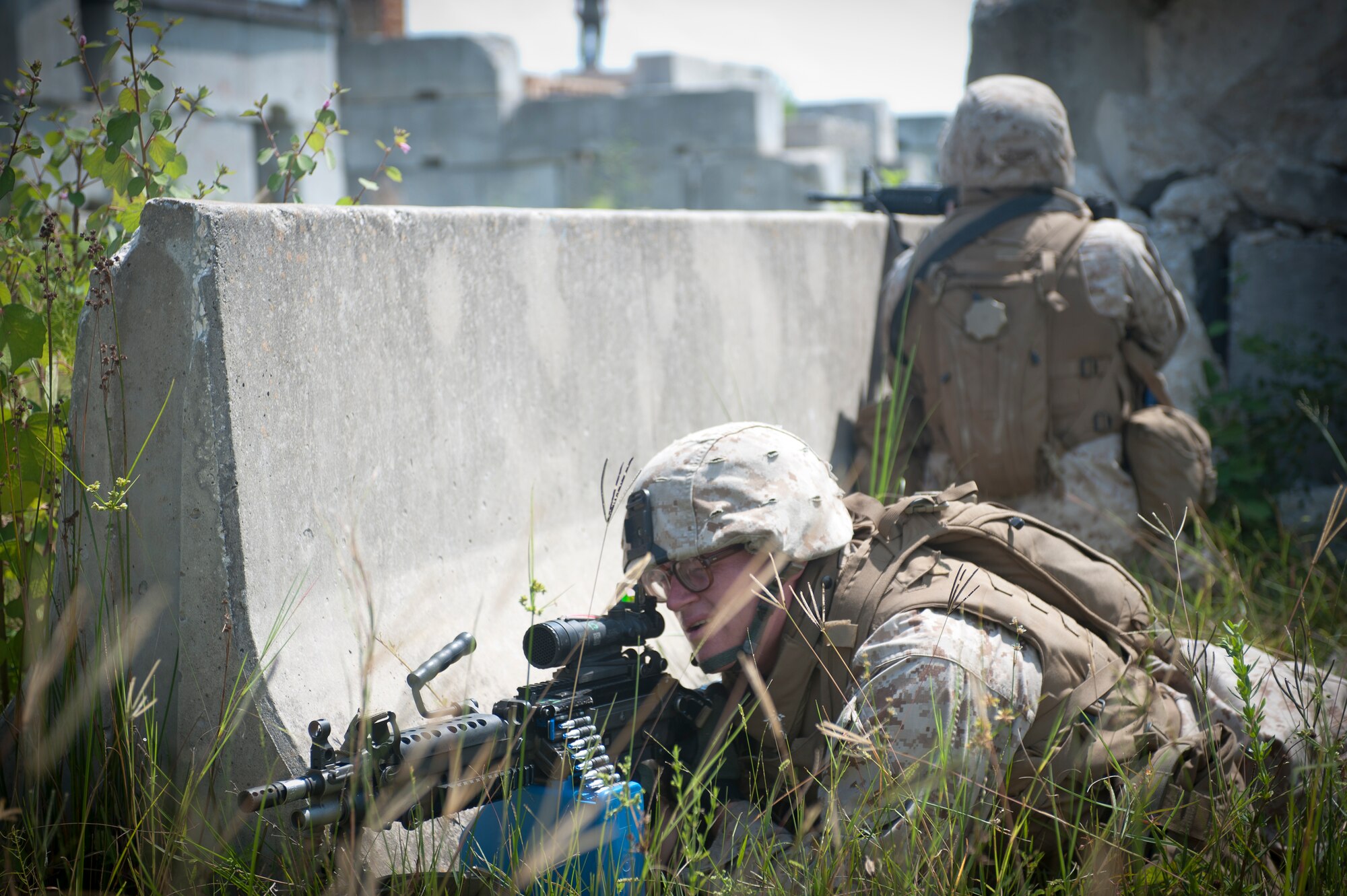 U.S. Marine Corps Pfc. Jacob York, 2nd Tank Battalion anti-tank missileman, and another Marine cover a road leading through a military operations in urban terrain village Sept. 13, at Avon Park Air Force Training Range. The Marines played the maneuver force and had to move through the village and eliminate the opposing force. (U.S. Air Force photo by Airman 1st Class Jarrod Grammel/Released)
