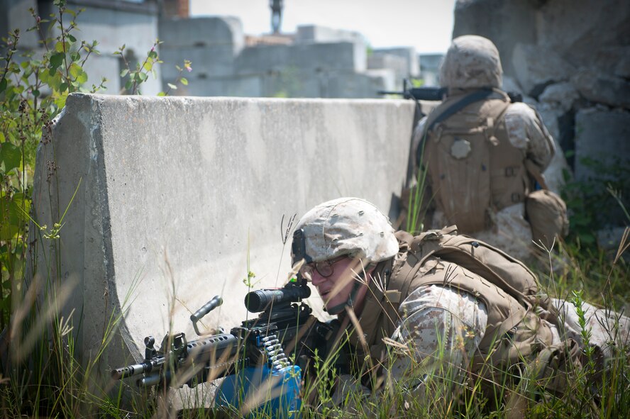U.S. Marine Corps Pfc. Jacob York, 2nd Tank Battalion anti-tank missileman, and another Marine cover a road leading through a military operations in urban terrain village Sept. 13, at Avon Park Air Force Training Range. The Marines played the maneuver force and had to move through the village and eliminate the opposing force. (U.S. Air Force photo by Airman 1st Class Jarrod Grammel/Released)
