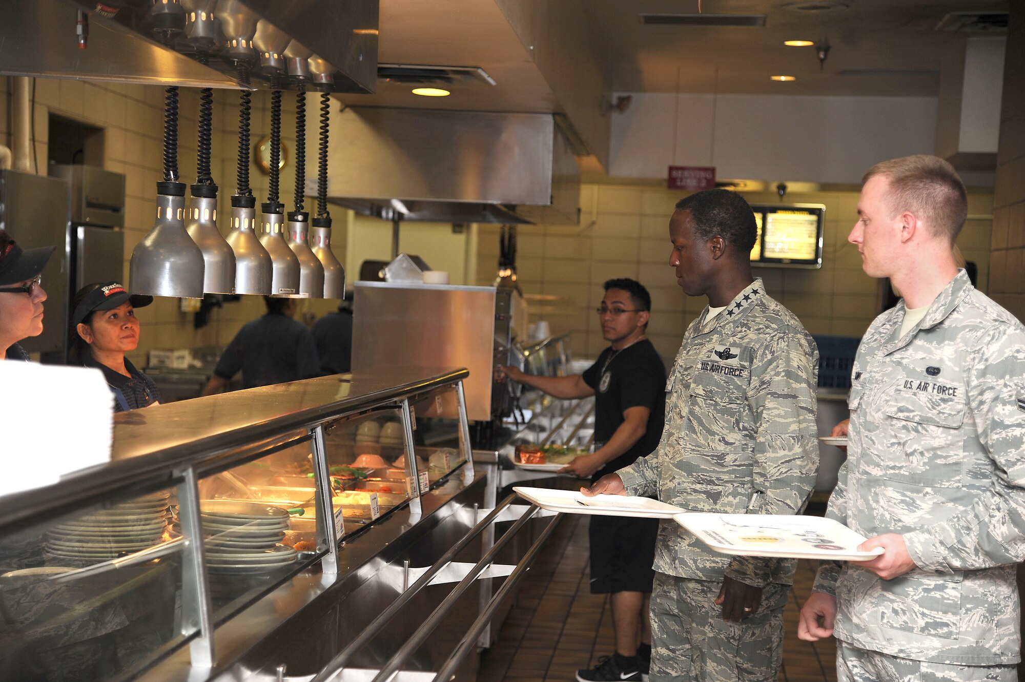 GOODFELLOW AIR FORCE BASE, Texas -- Gen. Edward Rice, Commander of Air Education and Training Command, goes through the Western Winds dining facility lunch line.  During his visit here Sept. 14-15, the general took time to eat lunch with Airmen.  (U.S. Air Force photo/Airman 1st Cliass Michael Smith)