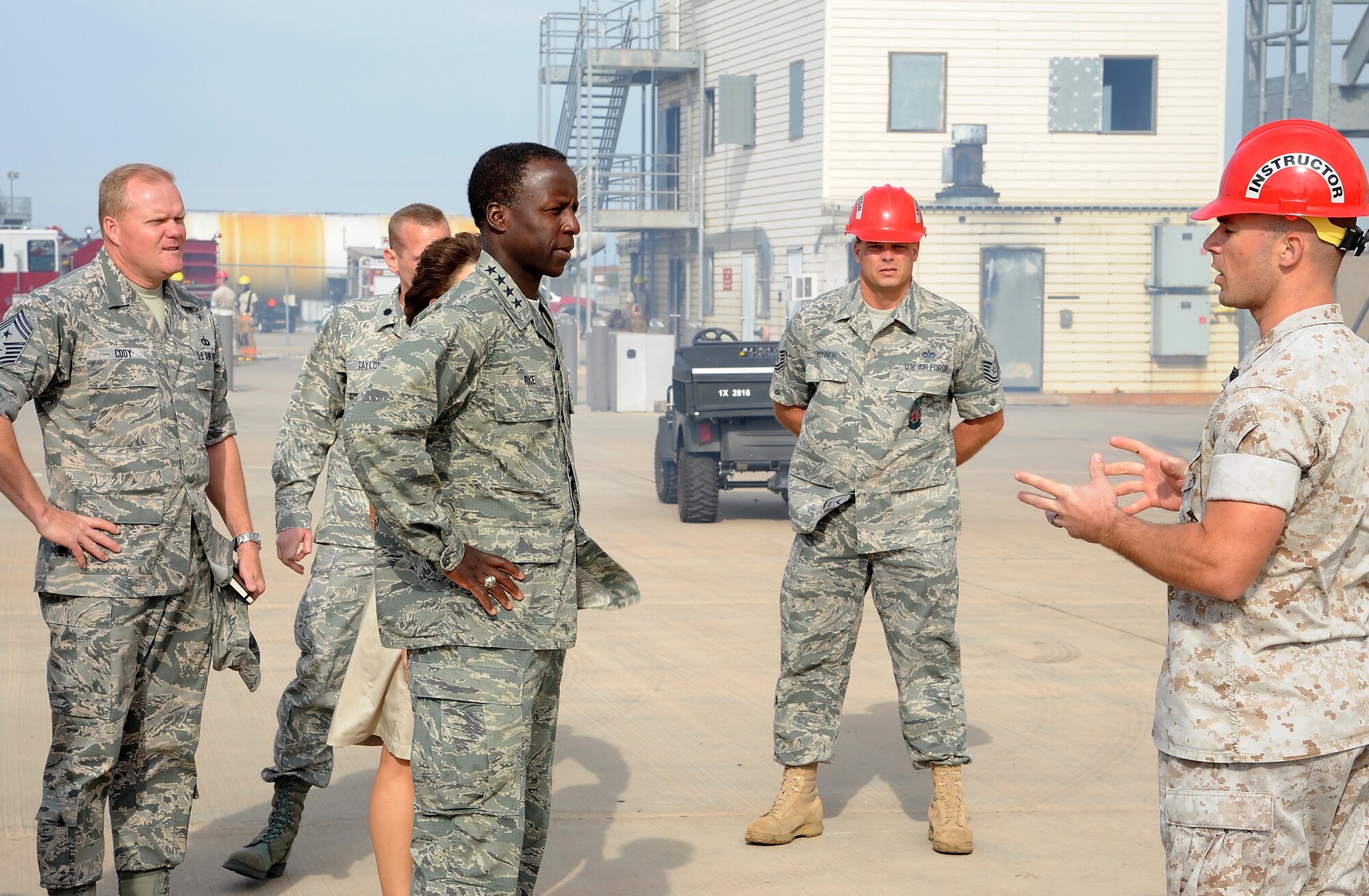 GOODFELLOW AIR FORCE BASE, Texas -- Gen. Edward Rice, Commander of Air Education and Training Command, receives a briefing from Marine Gunnery Sgt. Jason Goulter, Fire Academy Instructor, as Tech. Sgt. Frank Pyner, Fire Academy Instructor, looks on during the general's visit here Sept. 14-15. (U.S. Air Force photo/Airman 1st Class Michael Smith)