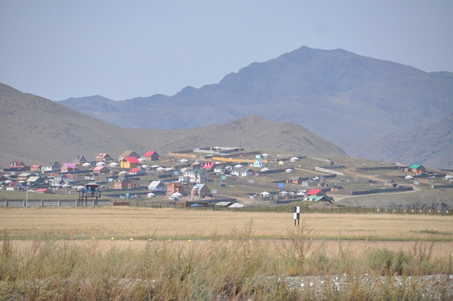 During a space debris retrieval mission in August, 2011, veteran airlift crew members from March Air Reserve Base, Calif., said Mongolia seemed much unchanged since the military's first flight into the country in 1991.  Here a village sits on a hill overlooking the Chinngis Khaan International Airport in Mongolia, Aug. 26, 2011. (U.S. Air Force photo/Master Sgt. Linda Welz)A Mongolian village sits on a hill overlooking the airport where the March C-17 picked up the rocket debris.