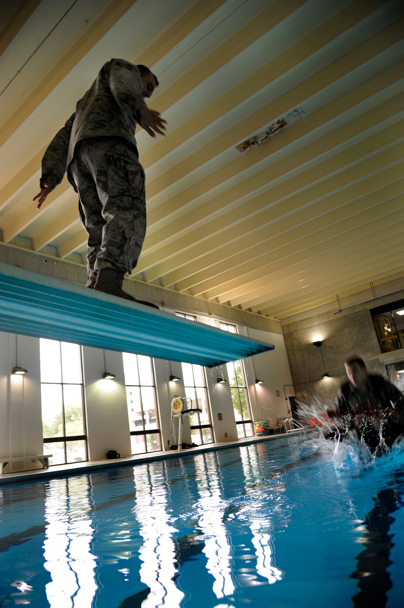 WARRENSBURG, Mo. - Airman 1st Class Brian Whitaker, 509th Security Forces Squadron memeber, is tossed into a pool after being spun five times during water survival training Sept. 15. These Airmen are brushing up on skills needed to get a recommendation to the Air Force Pre-Ranger Course. The Airman that shows the most leadership abilities and highest physical and mental endurance throughout training will be sent. (U.S. Air Force photo by Senior Airman Cody H. Ramirez)
