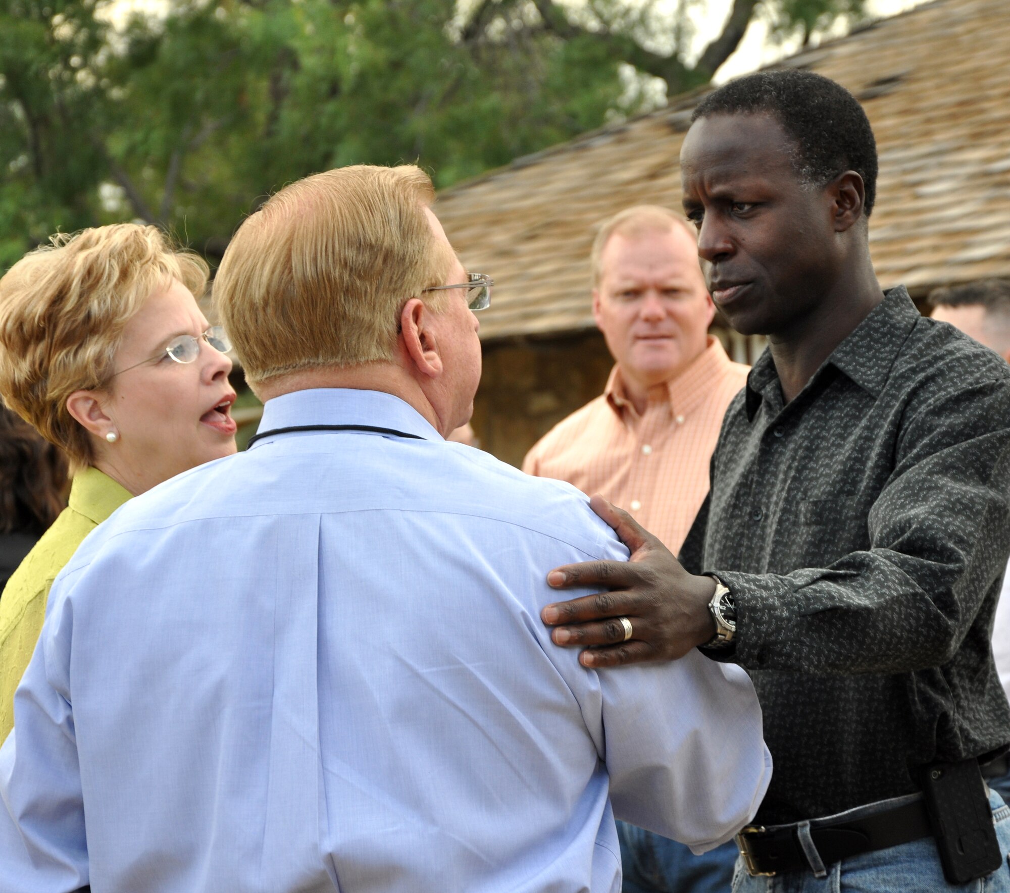 SAN ANGELO, Texas -- Gen. Edward Rice, Commander of Air Education and Training Command, greets Lee Pfluger, a local businessman, and Dr. Carol Ann Bonds, San Angelo Independent School District superintendent, at Fort Concho during his visit to Goodfellow Air Force Base Sept. 14-15.  Pfluger and Bonds are members of the general's AETC Commander's Group. (U.S. Air Force photo/Kent Cummins)