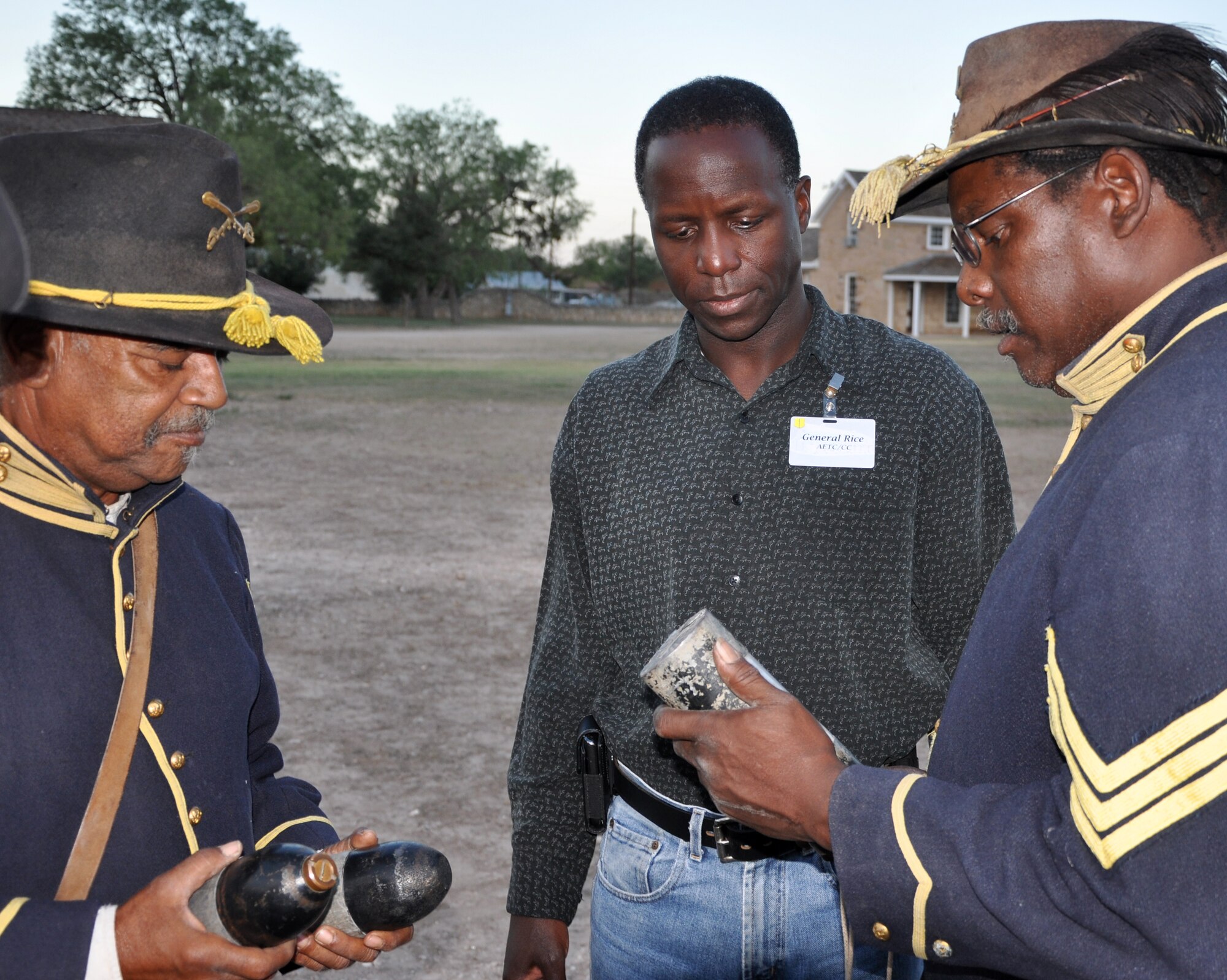 SAN ANGELO, Texas -- Gen. Edward Rice, Commander of Air Education and Training Command, speaks to Buffalo Soldier re-enactors Richard Brown and Paul Cook at historic Fort Concho during his visit to Goodfellow Air Force Base Sept. 14-15. (U.S. Air Force photo/Kent Cummins)