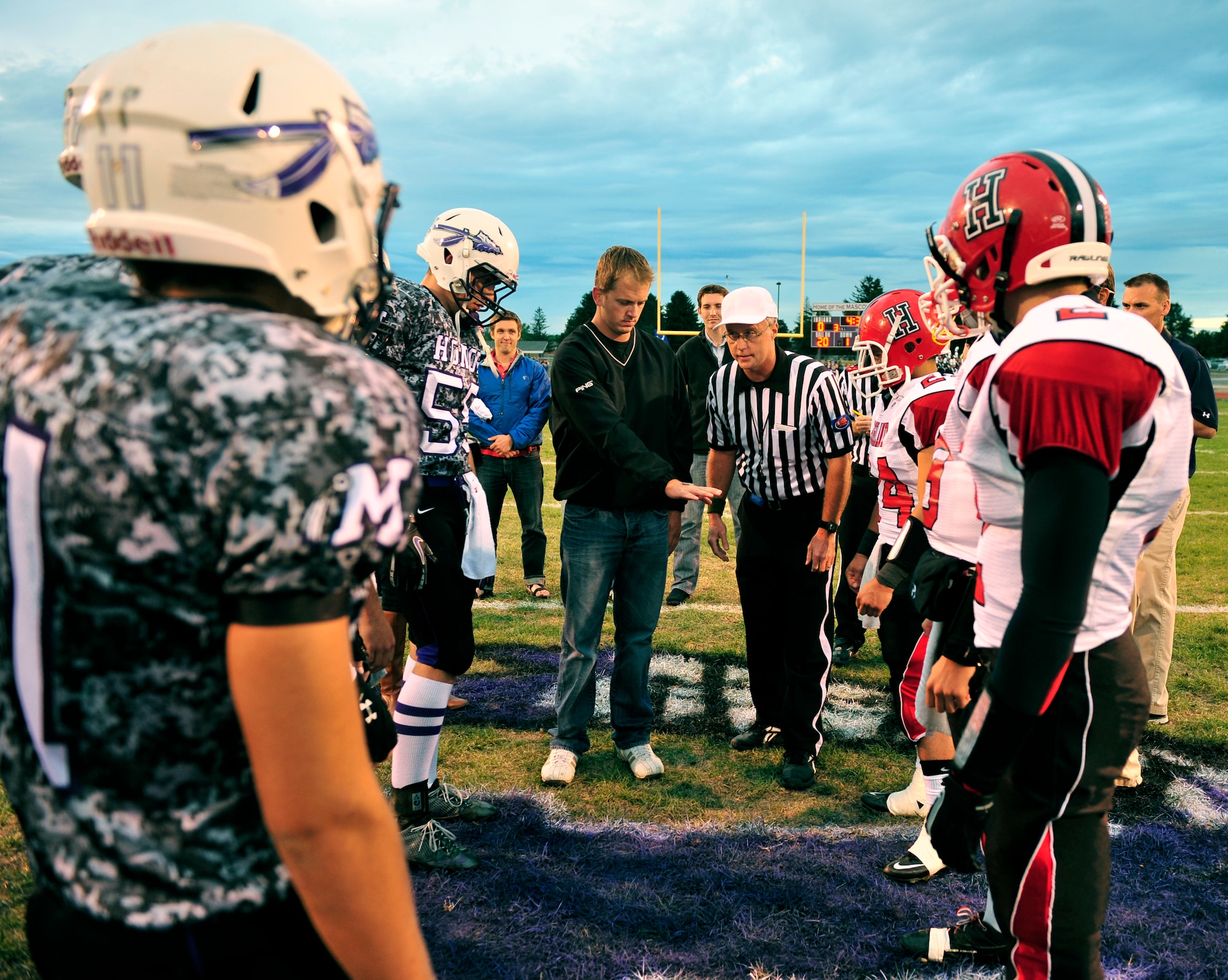 James Sperry, a wounded warrior from Lebanon, Ill., tosses the coin at the inaugural Annual Armed Forces Football Classic game Sept. 16, 2011 at Mascoutah High School Stadium. ( U.S. Air Force photo/ Staff Sgt. Stephenie Wade)
