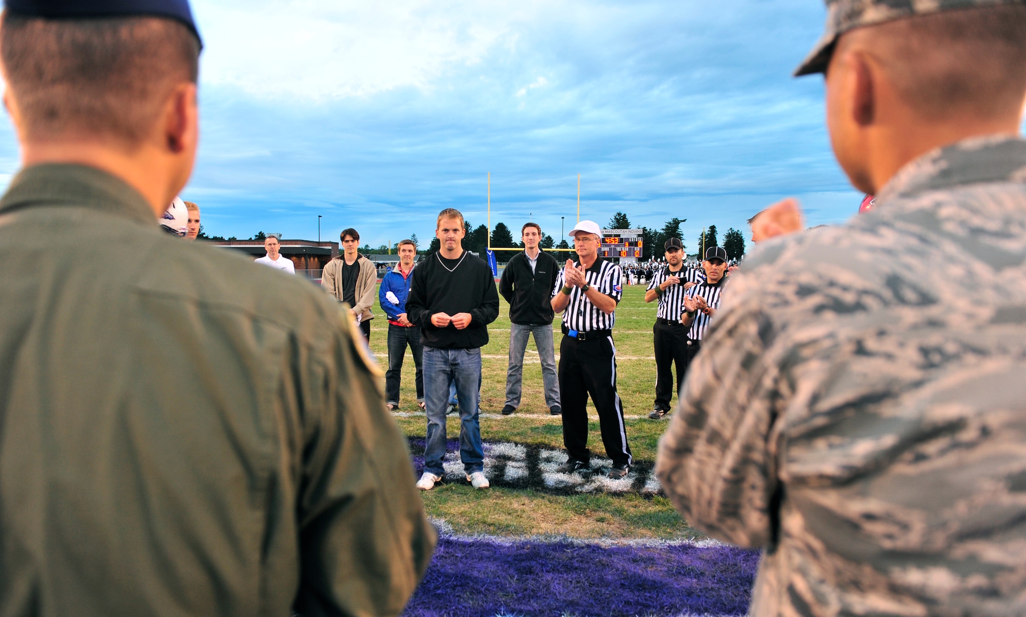 James Sperry, a wounded warrior from Lebanon, Ill., tosses the coin at the inaugural Annual Armed Forces Football Classic game Sept. 16, 2011 at Mascoutah High School Stadium. ( U.S. Air Force photo/ Staff Sgt. Stephenie Wade)