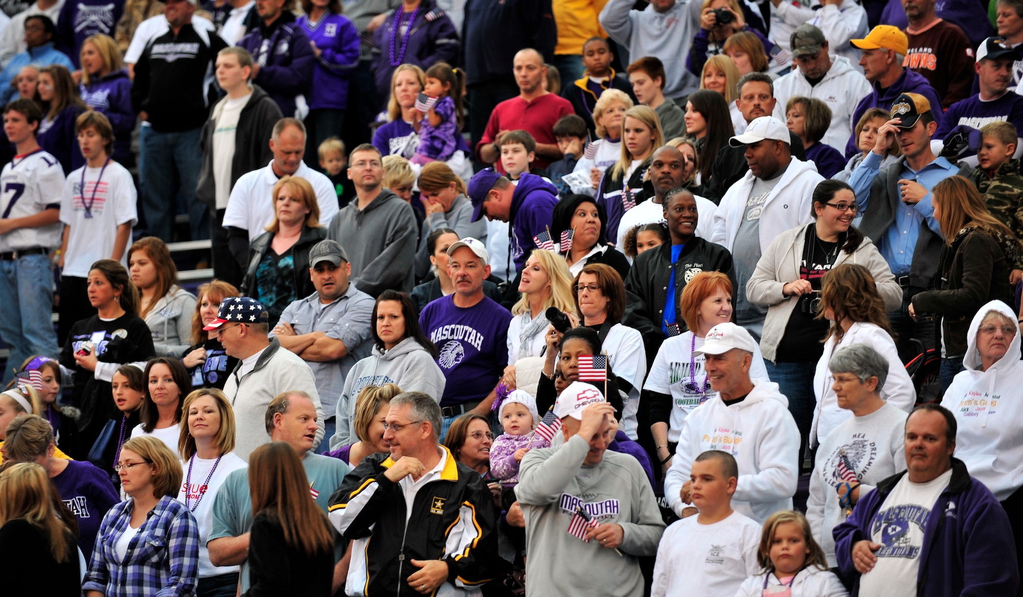 Team Scott and Mascoutah Indians fans cheer and wave American flags during the inaugural Annual Armed Forces Football Classic game Sept. 16, 2011 at Mascoutah High School Stadium. (U.S. Air Force photo/ Staff Sgt. Stephenie Wade)