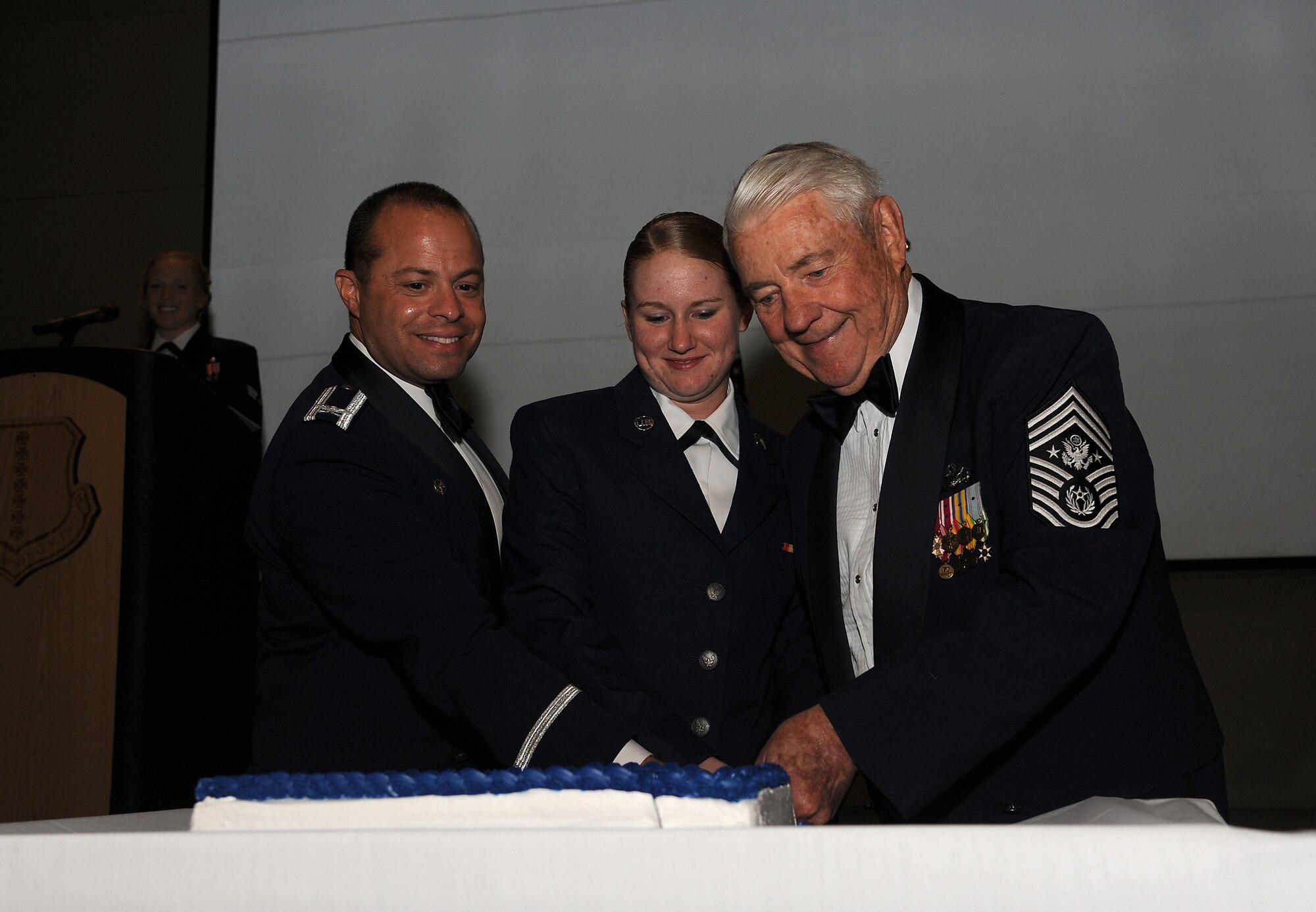 SAN ANGELO, Texas. -- Retired Chief Master Sgt. Robert D. Gaylor, the fifth Chief Master Sergeant of the Air Force, cuts the Air Force birthday cake with Airman Amanda Guiles, 17th Training Group student , and Col. Mark Damiano, 17th Training Wing Commander, at the Air Force ball Sept. 16 at the McNease Convention Center. The ball was a celebration of the Air Force’s 64th birthday, which was Sept. 18. (U.S. Air Force photo/Airman 1st Class Michael Smith)