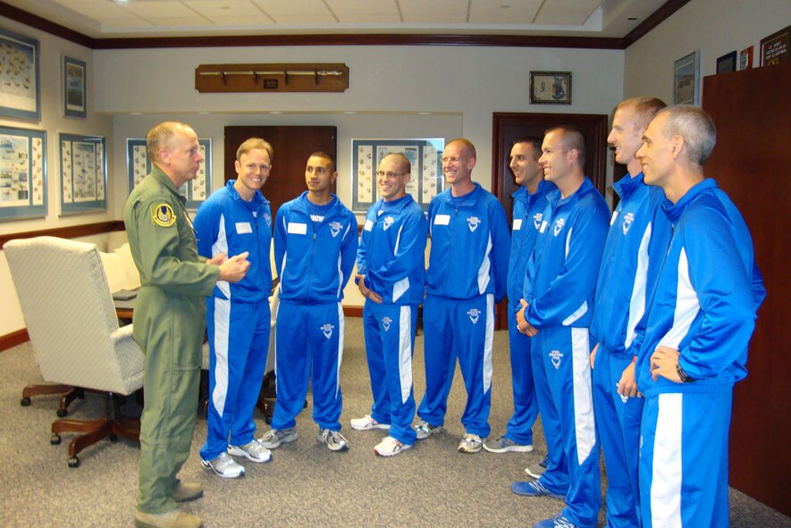 WRIGHT-PATTERSON AIR FORCE BASE, Ohio – Gen. Donald Hoffman (left), Air Force Materiel Command commander, speaks to members of the AFMC marathon team Sept. 16, the day before the Air Force Marathon. Maj. (Dr.) Derek Speten (second from left), from the 66th Medical Squadron, represented Hanscom on the AFMC team and ran the marathon in 3:48:33. (U.S. Air Force photo by Ron Fry)