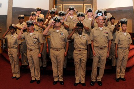 Newly pinned chief petty officers pose for a group photograph after a pinning ceremony at Joint Base Charleston-Weapons Station, Sept. 16. Eleven newly announced chief petty officers received their collar devices after completing the six-week chief petty officer induction season. (U.S. Navy photo/Mass Communication Specialist 1st Class Jennifer Hudson)
