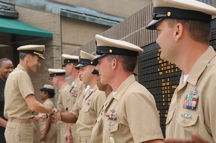 Captain Ralph Ward congratulates new chief petty officers after the Chief Petty Officer Pinning Ceremony held at Joint Base Charleston - Weapons Station Sept. 16. Ward is the JB CHS deputy commander. (U.S. Navy photo/Mass Communication Specialist 1st Class Jennifer Hudson) 