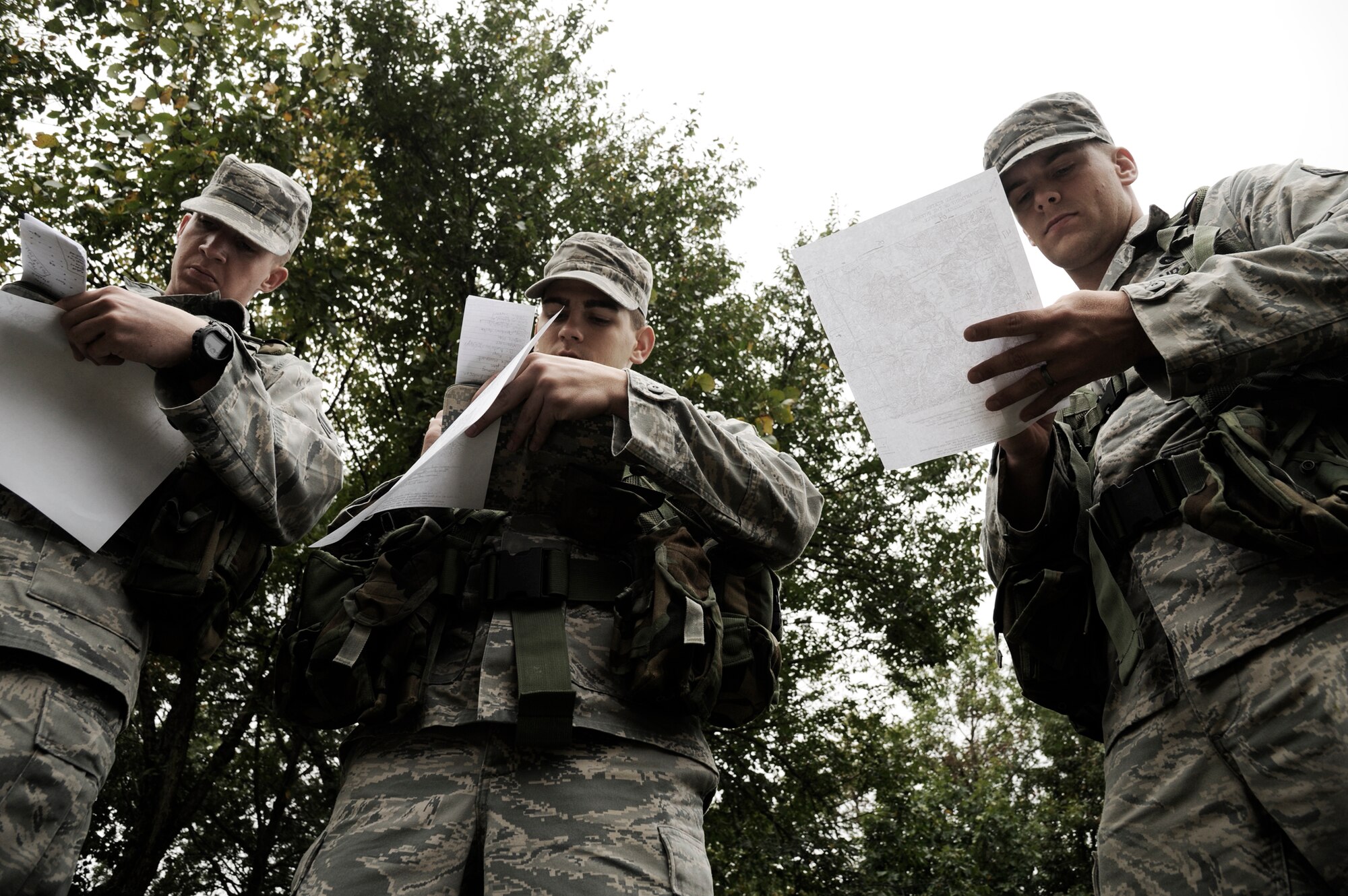 KNOB KNOSTER, Mo. - Airmen from the 509th Security Forces Squadron here mark down longitude and latitude of objective points during land navigation training Sept. 16. The training is being conducted to prepare these Airmen for the Air Force Pre-Ranger Course, which they are competing to attend. (U.S. Air Force photo by Senior Airman Cody H. Ramirez)