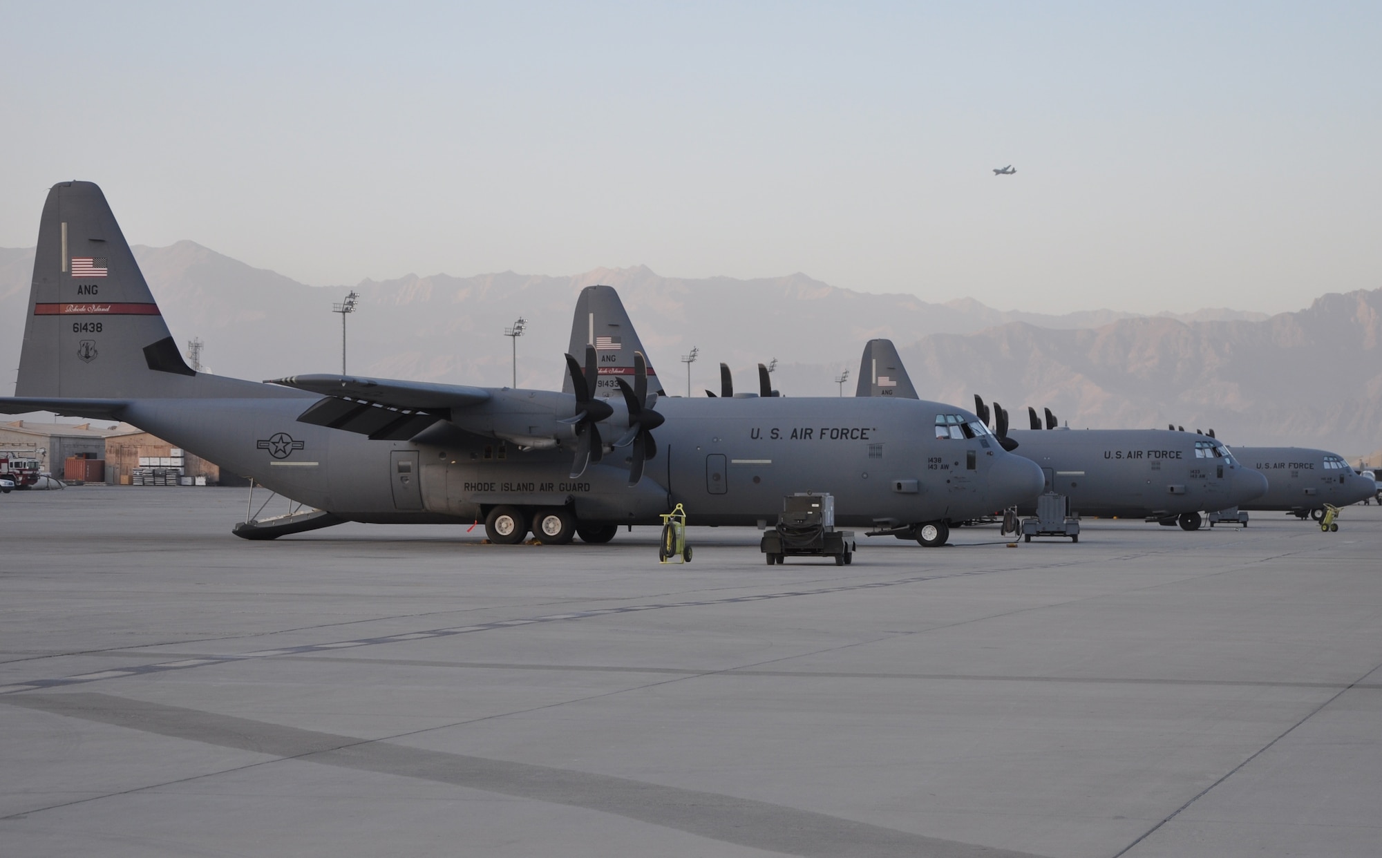 BAGRAM AIRFIELD, Afghanistan -- C-130J Hercules aircraft from the 774th Expeditionary Airlift Squadron stand ready to be loaded with cargo here Sept. 20, 2011.  The C-130J incorporates state-of-the-art technology to reduce manpower requirements, lower operating and support costs. The aircrafts’ improved engines enables the J-model to climb faster and higher, flies farther at a higher cruise speed, and takes off and lands in a shorter distance. (U.S. Air Force photo/Staff Sgt. John Wright)