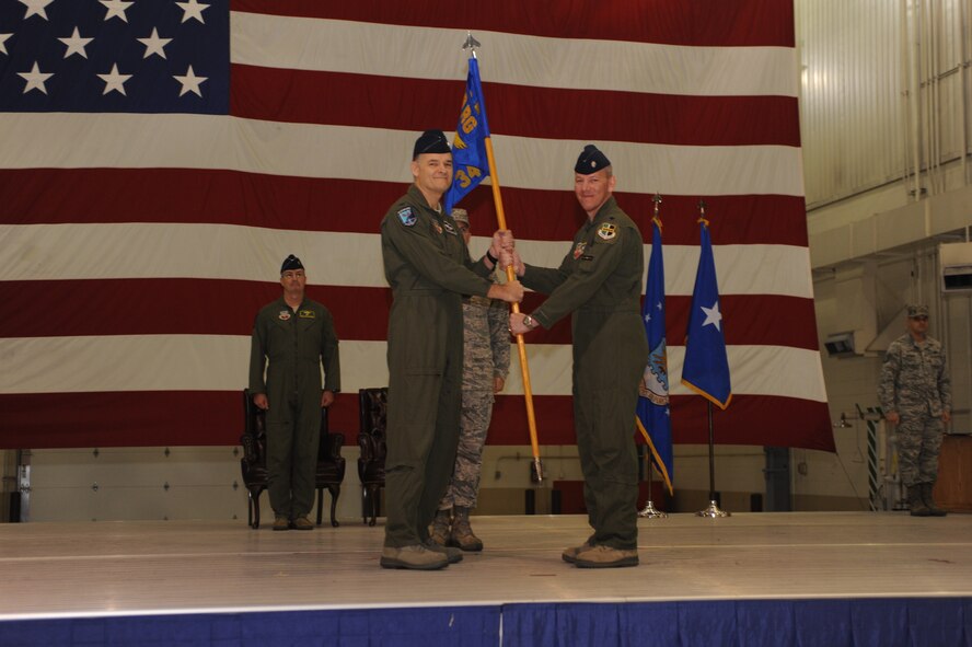 Lt. Col. Scott West, commander of the 348th Reconnaissance Squadron, receives the guiedon from Brig. Gen. Paul McGillicuddy, commander, 9th Reconnaissance Wing, during the 69th Reconnaissance Group activation of command. The 348th RS and the 69th Maintenance Squadron were activated and fall under command of the 69th RG. (U.S. Air Force photo/Staff Sgt. Suellyn Nuckolls)