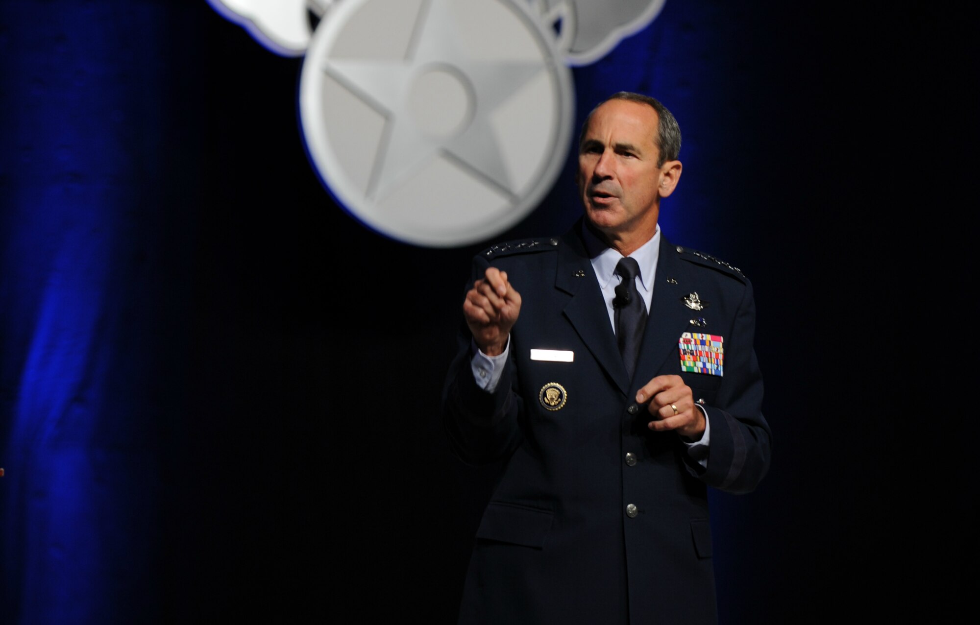 Gen. Ray Johns speaks about a variety of Air Force mobility missions Sept. 19, 2011, at the Air Force Association's 2011 Air & Space Conference and Technology Exposition in National Harbor, Md. Johns highlighted the mobilization of equipment and mobility Airmen “answering the call” for humanitarian and wartime missions. Johns is the Air Mobility Command commander. (U.S. Air Force photo/Staff Sgt. Tiffany Trojca)