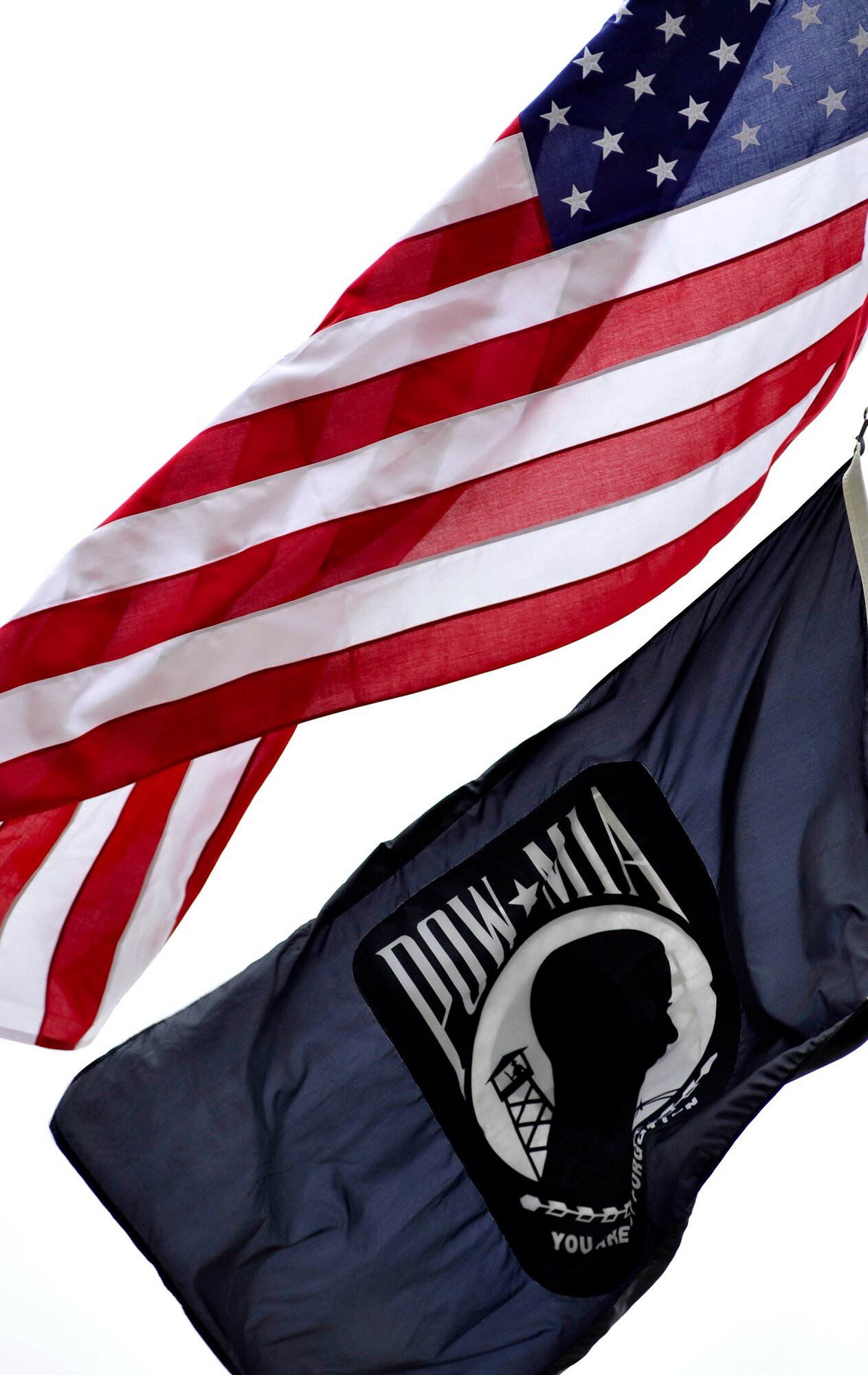 The American flag and POW/MIA flag fly high at the Sumter court house during a ceremony recognizing national prisoners-of-war and missing-in-action day, Sept. 16, 2011 Sumter, S.C. During the ceremony Louis Blanding Fowler, former prisoner of war, spoke about his service in World War II and was presented a POW/MIA flag. (U.S. Air Force photo by Senior Airman Kenny Holston/Released)


