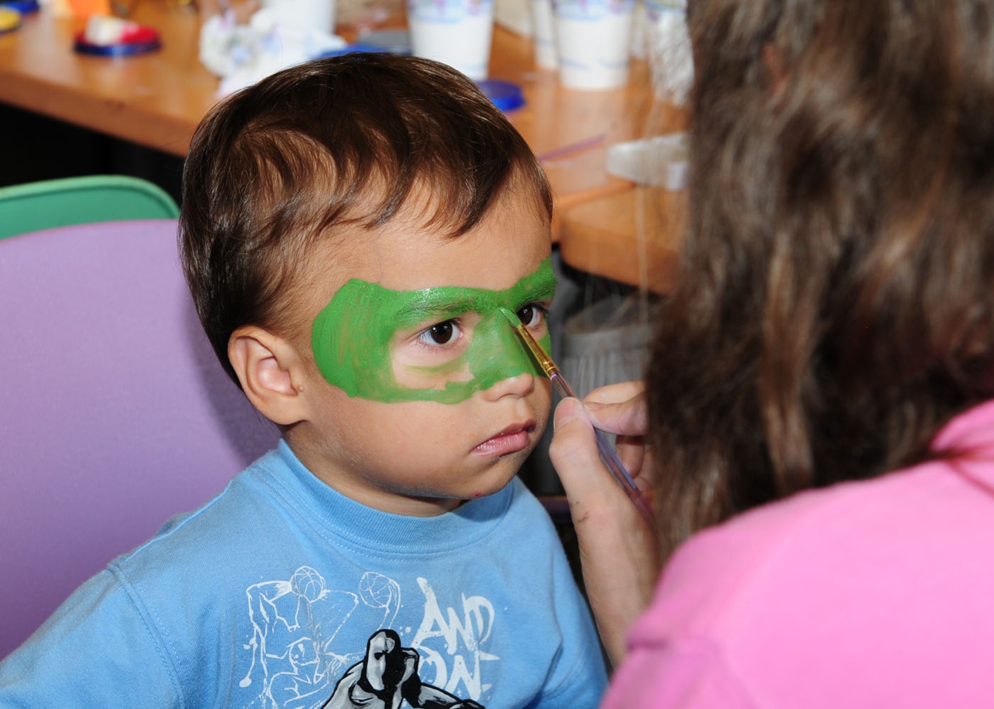 RAF MILDENHALL, England -- Matthew Joiner, 2, son of Tech. Sgt. Neil Joiner, 100th Air Refueling Wing, gets his face painted at the Boys and Girls Clubs of America's Day for Kids Sept. 17, 2011, at the youth center. Staff at the youth center organized many different events to encourage children to spend time and have fun with their families. (U.S. Air Force photo by Karen Abeyasekere)
