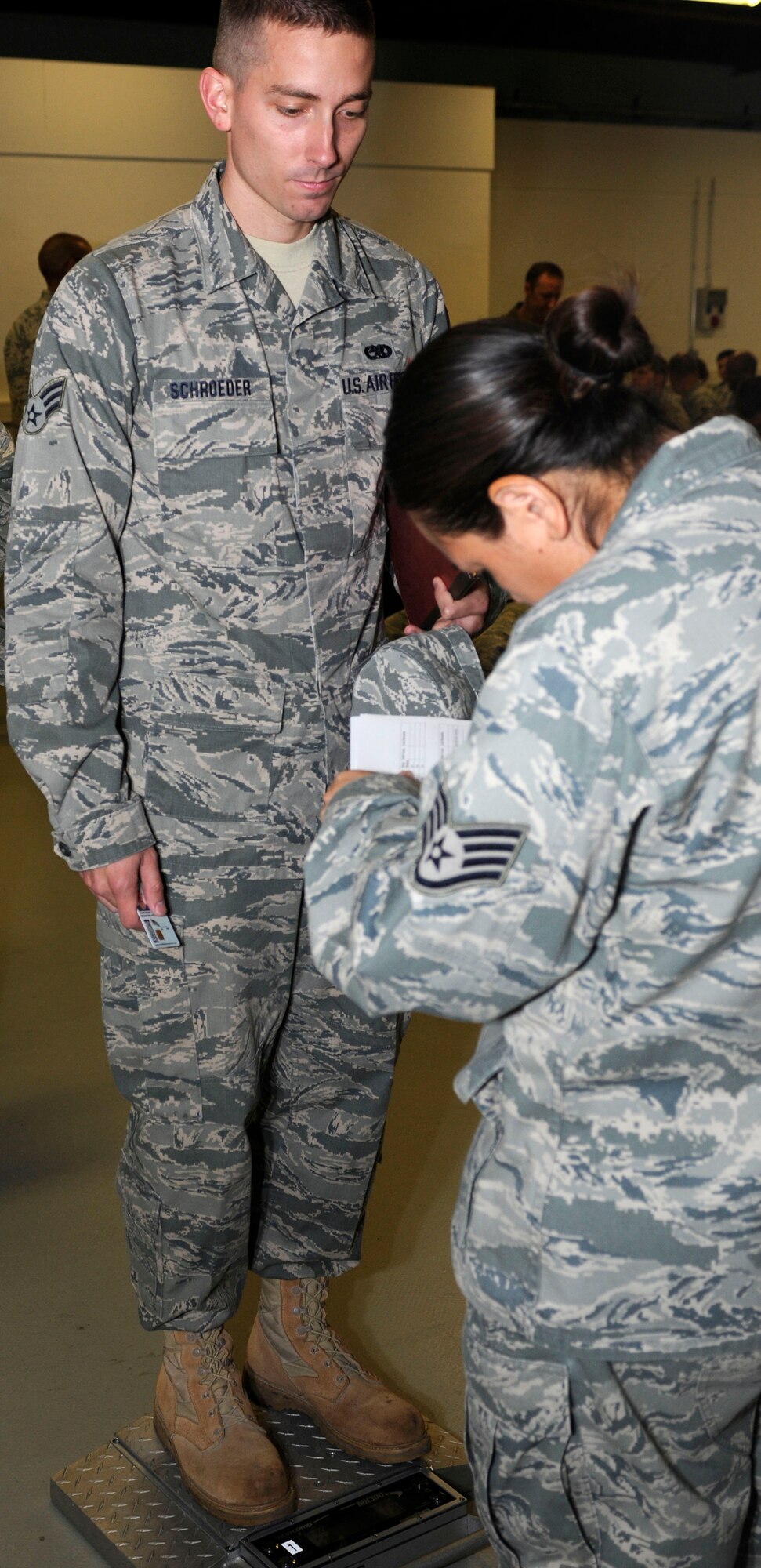 SPANGDAHLEM AIR BASE, Germany -- Senior Airman Bradford Schroeder, 52nd  Component Maintenance Squadron, weighs-in during a personnel deployment function line here.  The PDF line consists of base agencies that ensure deploying members have all necessary paperwork and checklists completed before leaving. Schroeder is deploying with the 81st Fighter Squadron in support of Operation Enduring Freedom. (U.S Air Force photo/Senior Airman Natasha E. Stannard)