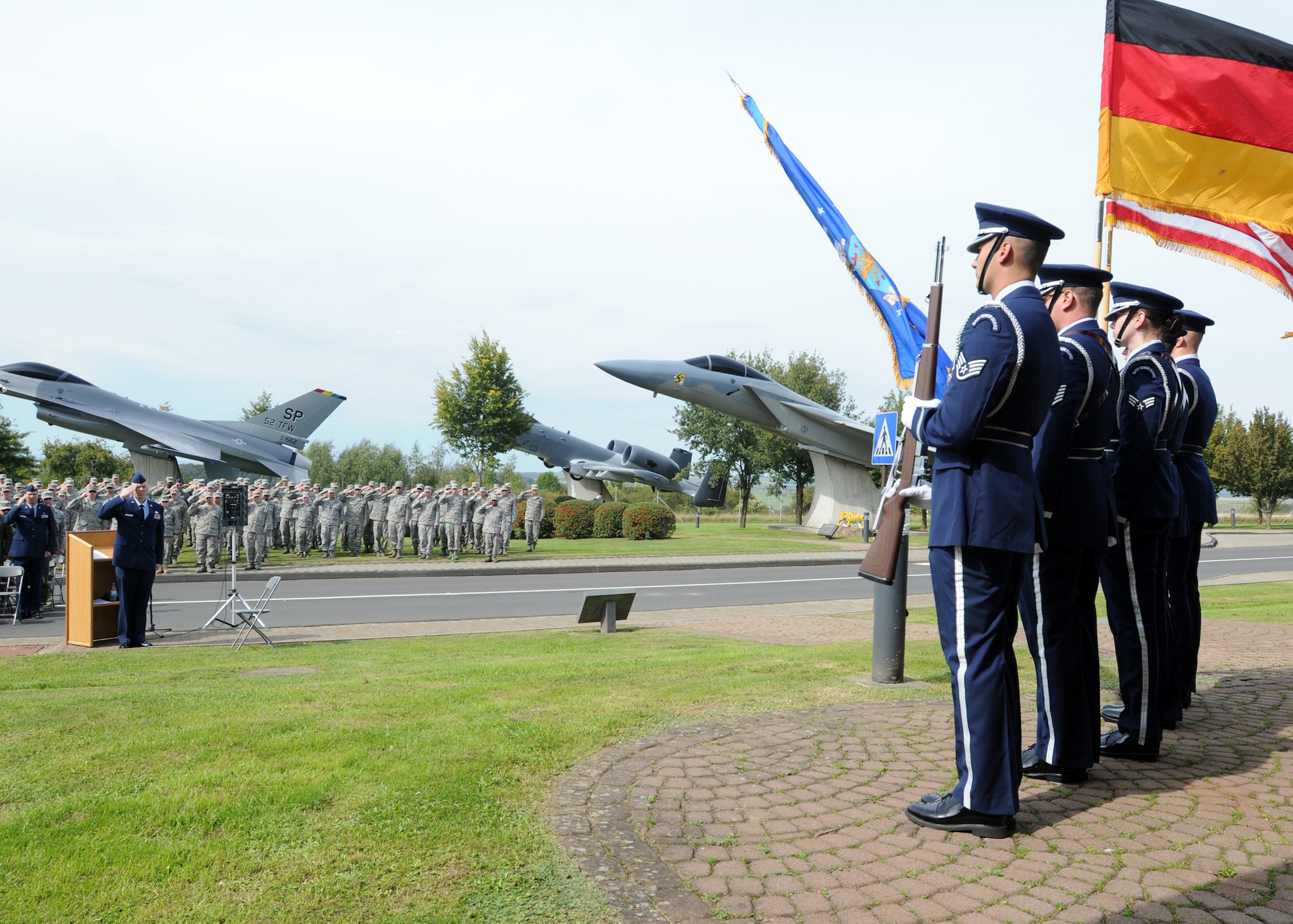 SPANGDAHLEM AIR BASE, Germany - 52nd Fighter Wing Honor Guard members post the colors as 52nd FW members salute during the POW/MIA ceremony at the air park here Sept. 16. The ceremony is held every year to remember those who have served and been taken prisoner or have been listed as missing in action. (U.S. Air Force photo/Senior Airman Christopher Toon) 