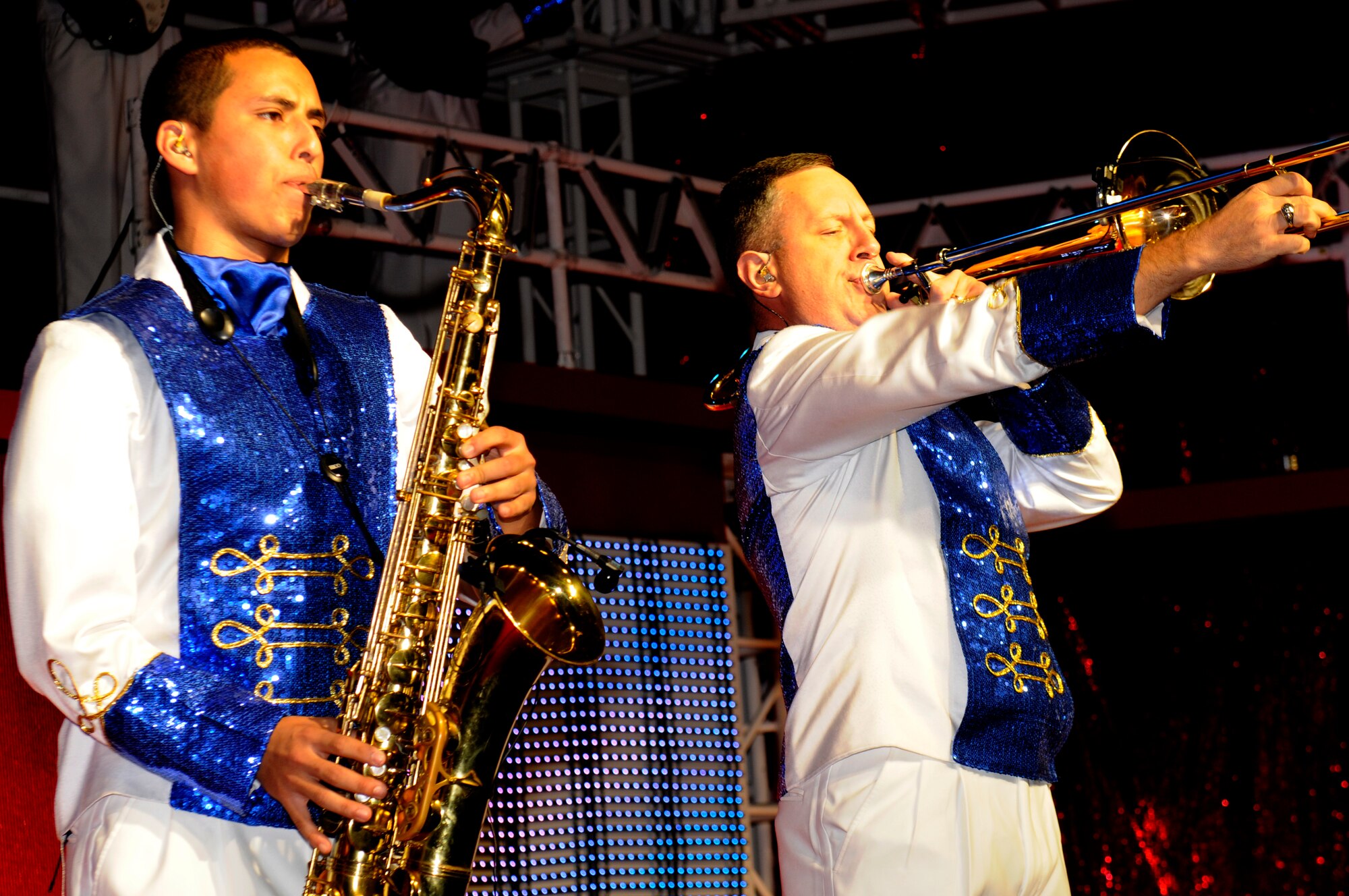 SPANGDAHLEM AIR BASE, Germany -- Air Force Tops in Blue saxophonist Airman 1st Class Gabriel Villanueva, 436th Operations Support Squadron, Dover Air Force Base, Del., and trombonist Senior Master Sgt. Clayton Johnson, 561st Network Operations Squadron, Peterson AFB, Colo., perform for Spangdahlem service members and their families at the Skelton Memorial Fitness Center here Sept. 18. Tops in Blue is an active duty Air Force special unit made up of talented amateur performers selected for their entertainment abilities. The 2011 tour, “Rhythm Nation,” brings to life the music of America from the early 1900s through today. (U.S. Air Force photo/Airman 1st Class Brittney Frees)