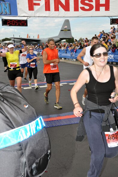 Staff Sgt. Megan Crusher is all smiles after completing her half marathon run. The event was part of the Air Force Marathon events held at Wright-Patterson AFB, Ohio. Sept. 17. (U.S. Air Force Photo/Tech. Sgt. Joe Davidson)