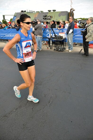 Chief Master Sgt.Terry Luzader, 4th AF Aviation Resource Management Office at March takes a breather after finishing her half marathon. The Chief placed first in her division and 49 overall. She finished in the 89.2 percentile in her age grade putting her just below the world class category. The half marathon event was part of the Air Force Marathon events held at Wright-Patterson AFB, Ohio, Sept. 17. (U.S. Air Force Photo/Tech. Sgt. Joe Davidson)