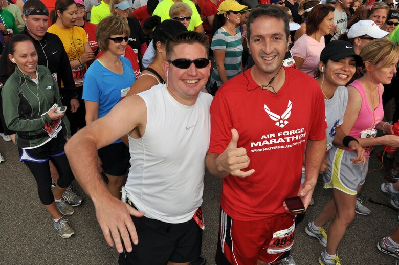 Senior Master Sgt. Brian Sammons and Senior Airman Paul Deike from the 452 LRS pause briefly for their photo just before beginning their half marathon during the Air Force Marathon weekend held at Wright-Patterson AFB, Ohio, Sept. 16-17. (U.S. Air Force Photo/Tech. Sgt. Joe Davidson)