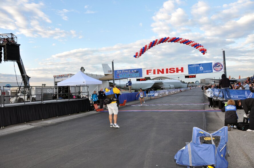 Team March's Senior Airman Kristoffer Chacon crosses the finish line after completing the 10K run. He placed fourth overall in this event. On Sept. 16 he ran a 5K race and placed first in the military category. All of the marathon events were ran on and around Wright-Patterson AFB, Ohio, Sept. 16-17 (U.S. Air Force Photo/Tech. Sgt. Joe Davidson)