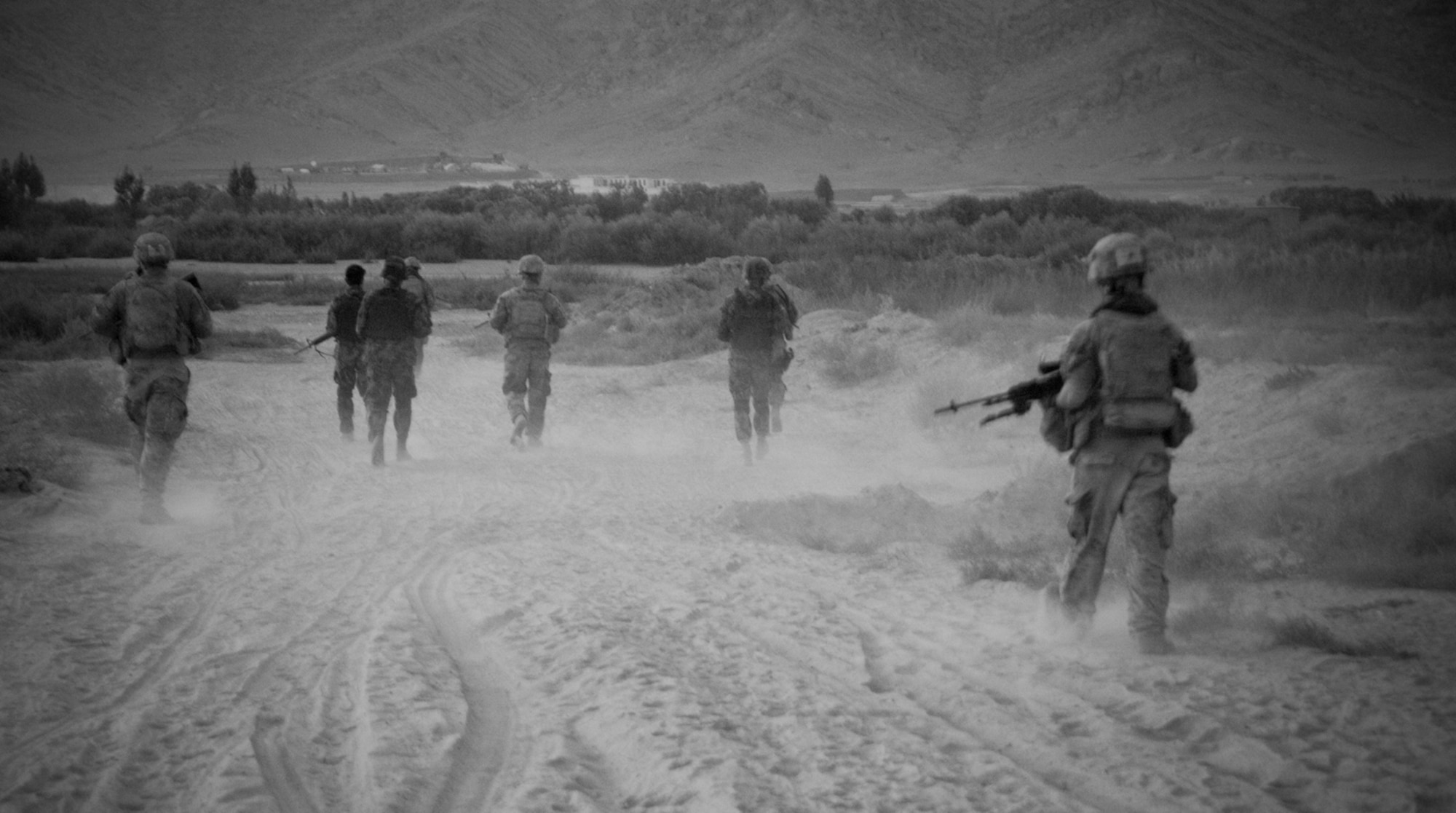 Afghan and U.S. Air Force airmen and soldiers from 1st Squadron, 24th Infantry Division, Fort Wainwright, Alaska, conduct an evening foot patrol within the ground defense area of Kandahar Airfield, Afghanistan, Sept, 3, 2011. The partnered patrols allow Afghan Airmen to build trust and a security presence with off base village communities, and it allow them to monitor insurgent activity. (U.S. Air Force photo by Senior Airman Jessica Lockoski 


