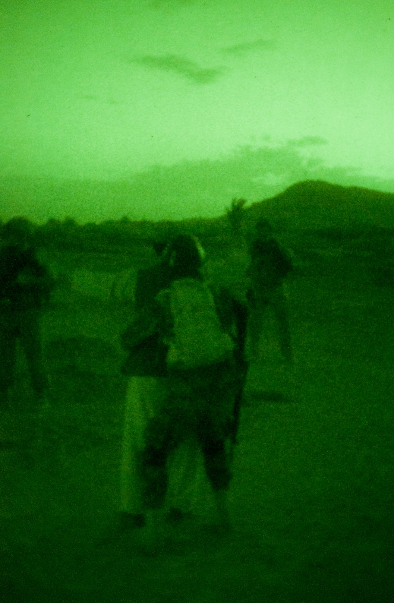 An Afghan Air Force security forces airman assigned to the Kandahar Air Wing searches a potential suspect in the ground defense area surrounding Kandahar Airfield, Afghanistan, Sept. 3, 2011 during an evening foot patrol. U.S. Air Force security forces Airmen and Soldiers from the 1st Squadron, 24th Infantry Division, Fort Wainwright, Alaska, conduct patrols with Afghan airmen around the ground defense area to thwart threats against the airfield. (U.S. Air Force photo by Senior Airman Jessica Lockoski 


