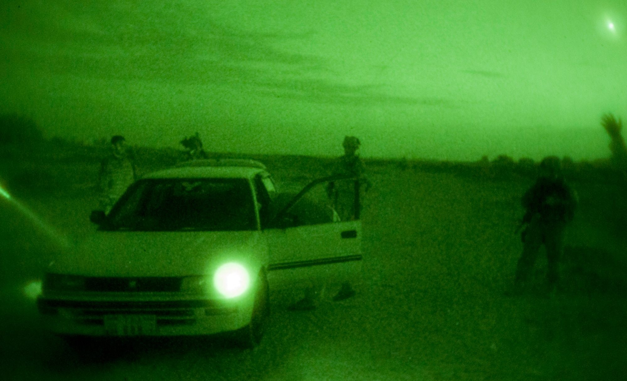 Afghan and U.S. Air Force airmen and soldiers from 1st Squadron, 24th Infantry Division, Fort Wainwright, Alaska, search a vehicle during an evening foot patrol within the ground defense area of Kandahar Airfield, Afghanistan, Sept, 3, 2011. The partnered patrol team talked to village leaders and searched for insurgent activity and threats in communities surrounding the airfield. (U.S. Air Force photo by Senior Airman Jessica Lockoski 


