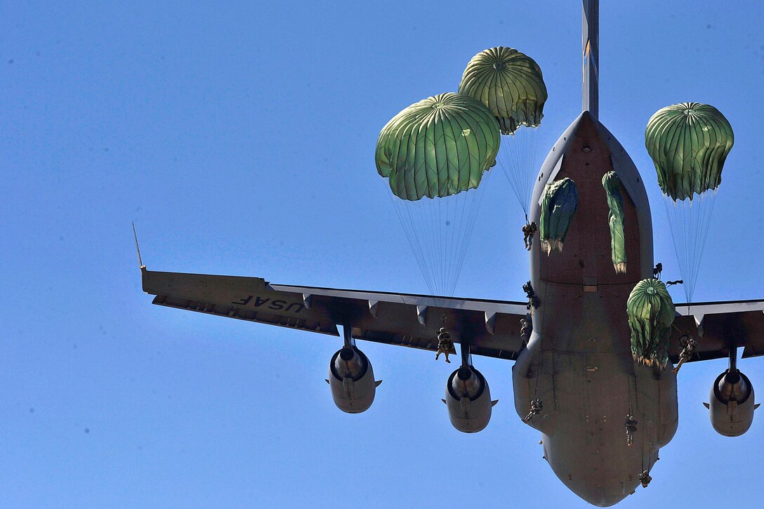 Paratroopers jump out of a C-17 Globemaster III aircraft over drop zone Sicily during a joint operational exercise on Fort Bragg, N.C., Sept. 10, 2011. The paratroopers are assigned to the 82nd Airborne Division.