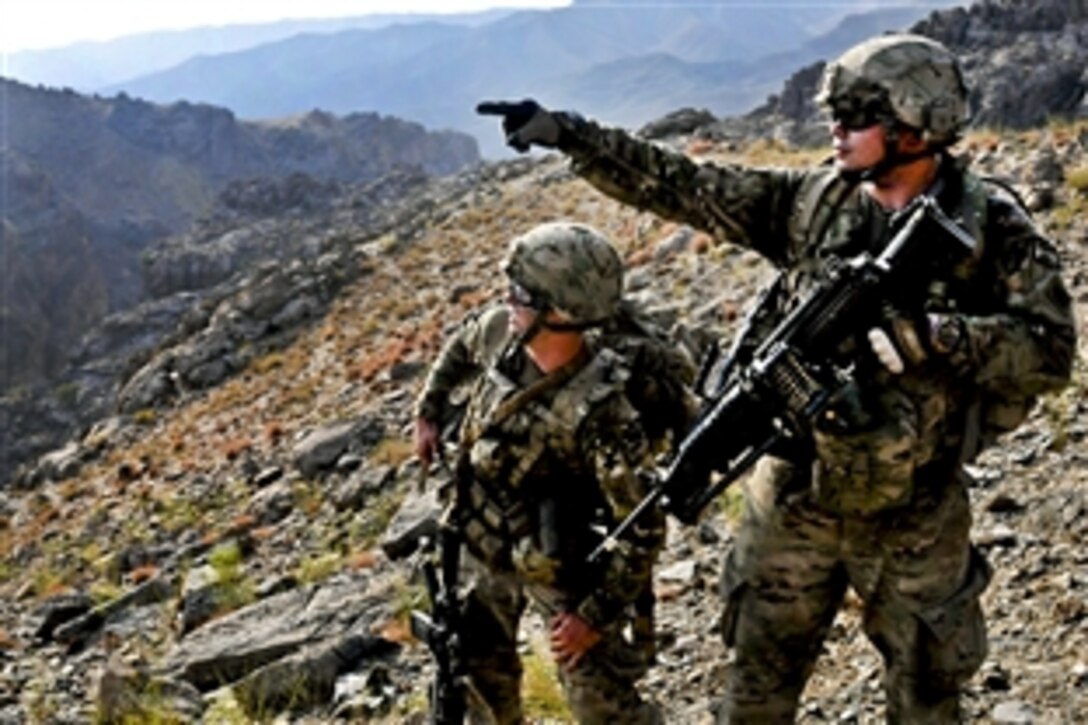 U.S. Army Spcs. Ryan Roach, left, and Jared Price scout a ridgeline for enemies during Operation Lionheart in Parwan province, Afghanistan, Sept. 12, 2011. Roach and Price are assigned to Company B, 1st Battalion, 179th Infantry Regiment, 45th Infantry Brigade Combat Team.