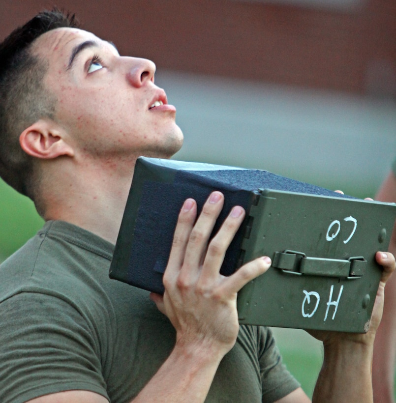 Sgt. Benjamin Venhuizen, military policeman, Military Police Company, Headquarters Battalion, 2nd Marine Division, pushes out ammo can lifts during his Combat Fitness Test Sept. 21, aboard Marine Corps Base Camp Lejeune, N.C. Marines have until Dec. 31, 2011, to qualify for the CFT. For complete information on the CFT, refer to Marine Corps Order 6100.13 for rules and regulation.