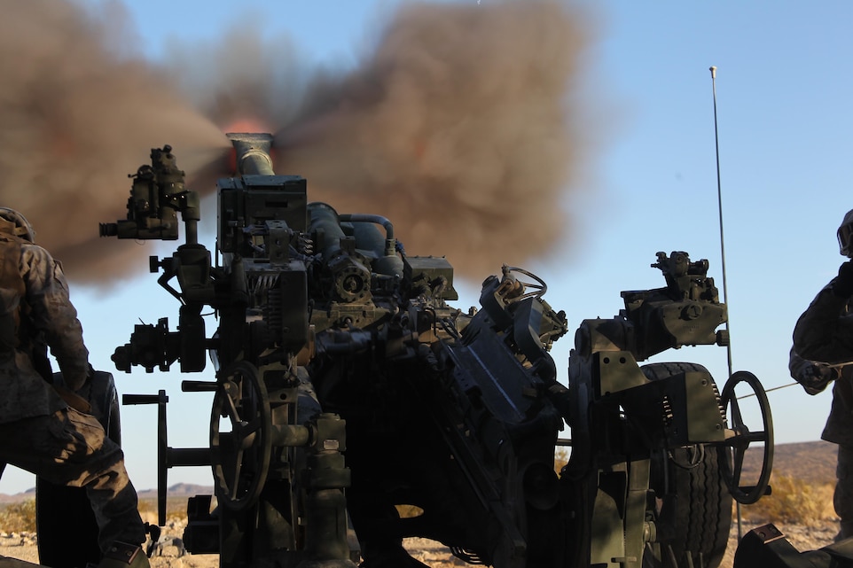 Marines from Gun 3 of Battery S, 5th Battalion, 10th Marine Regiment, provide support fire during 3rd Bn., 3rd Marines’ Enhanced Mojave Viper pre-deployment training at the Combat Center’s Lava Training Area Sept. 20, 2011.::r::::n::