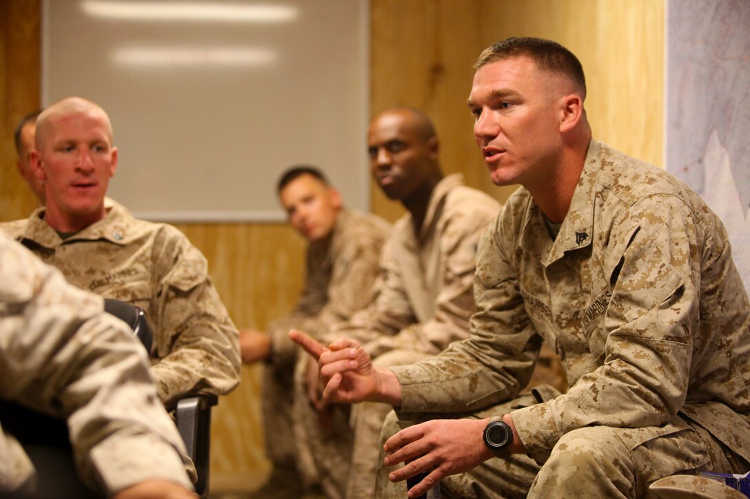 Rick C. Fedrizzi, the President Chief Operator of the Richard Petty Driver Experience, talks to Marines and sailors from 2nd Marine Logistics Group about the dangers of distractive driving during the Richard Petty Driver Experience at Marine Corps Auxiliary Landing Field Bogue, N.C., Sept. 21, 2011.  The course focused on braking, reaction times, tailgating and loss of control.  (Photo by Sgt. Rachael K. A. Moore)