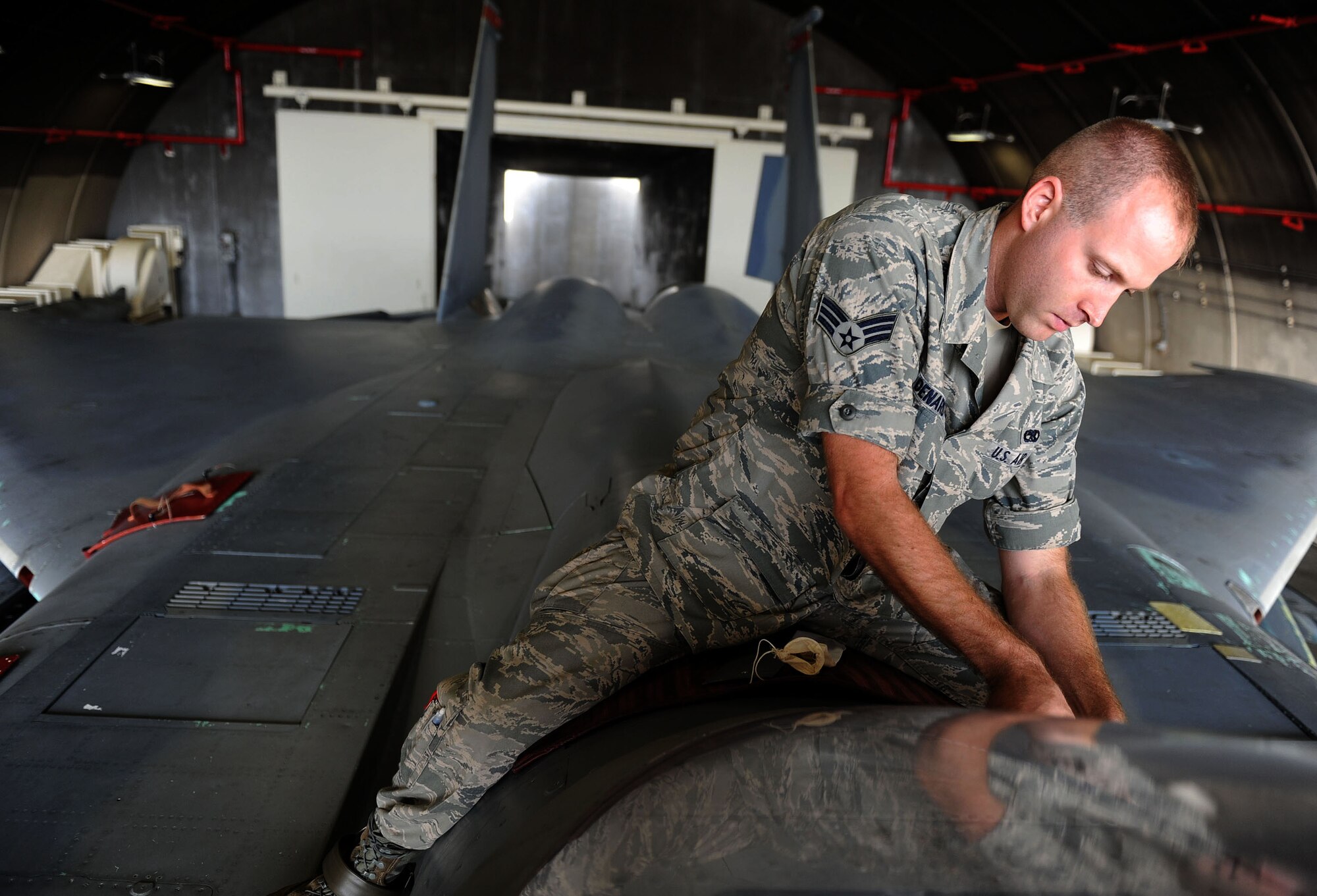 U.S. Air Force Senior Airman Paul Denardo, 18th Component Maintenance Squadron Egress Systems journeyman, unscrews parts from an F-15C Eagle canopy in order to remove the canopy and replace the ejection seat Sept. 21 at Kadena Air Base, Japan.  Airmen working with Egress Systems provide first rate aircrew escape system maintenance for 54 assigned F-15C and D model aircraft at Kadena. This includes arming, de-arming, removing, inspecting and installing Advanced Concept Ejection Seats (ACES II), parachutes, survival kits, and 3600 explosive batteries, initiators, detonating cords, and rockets involved in the swift and safe ejection of fighter aircrew here at Kadena. (U.S. Air Force photo by Senior Airman Sara Csurilla)